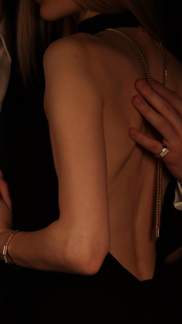 Most necklaces sit at one length. This one moves. The pendant slides along the chain, so the same piece changes completely depending on where you place it.
The design is built around a single mechanism. A diamond-studded pendant that slides freely along the chain rather than sitting fixed at one point. Pull it high and the necklace tightens toward the throat, the drop shortens, the piece reads as a close, structured line. Let it fall and the chain extends into a long lariat, the pendant dropping toward the décolleté, the whole character of the necklace changing with it. Worn to the front, worn down the back, worn high or low, it adjusts in seconds with one hand. The same piece, styled a dozen different ways, decided fresh each time it is put on.
The pendant carries 51 brilliant-cut diamonds in F-VS at 0.95 carats, across 44 centimetres of 18-carat yellow gold. On the hand, a rose gold cocktail ring set with 122 brilliant-cut diamonds in F-VS at 2.40 carats, and a yellow gold bangle set with 135 brilliant-cut diamonds at 1.50 carats.
Just visible at the edge of the frame, his ring. Rose gold, 78 brilliant-cut diamonds in F-VS at 0.68 carats. One half of a matching pair. The same house behind both.
By private appointment only.
The BrandZ - A Luxury Experience.
#thebrandz #jewellery #diamonds #necklace #couple