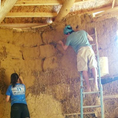 #clayplaster over #strawbale #Explained
The first coat is thin and sticky. The goal is just to work into and coat the surface of the straw completely. This gives the next layers something nice to grip to. The walls are uglier after this step. (You are not making the wall pretty at this stage!)
The second coat of clay plaster needs to be proportioned according to your particular clay. But typically about 25-30% total clay...with the rest being sand & chopped straw. The sand gives you compressive strength, while the chopped fiber gives you tensile strength. Both help the clay resist cracking. The goal of the 2nd coat is to shape the walls. Smooth out lumpiness & add any sculptural features.
The final plaster is your finish coat. There are many many recipes and techniques for creating finish clay plasters. The goal is to create the texture and color you want on your walls.
#howto #naturalbuilding #buildnaturally #healthyhome #naturalarchitecture #naturalinteriors