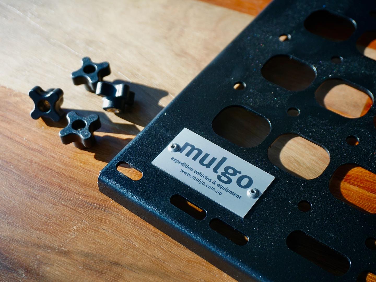 @tysonthefisherman designed and developed his first product for Mulgo.
This Universal Fit, Black Powder Coated, Aluminium Molle Panel with Quick Release is the perfect way to organise your Touring Vehicle.
Needless to say that it works seamlessly with our Mulgo Pop Top. It is however designed to allow fitment on cabinetry, canopies, vans, caravans … wherever storage space is a premium and quick access is needed.