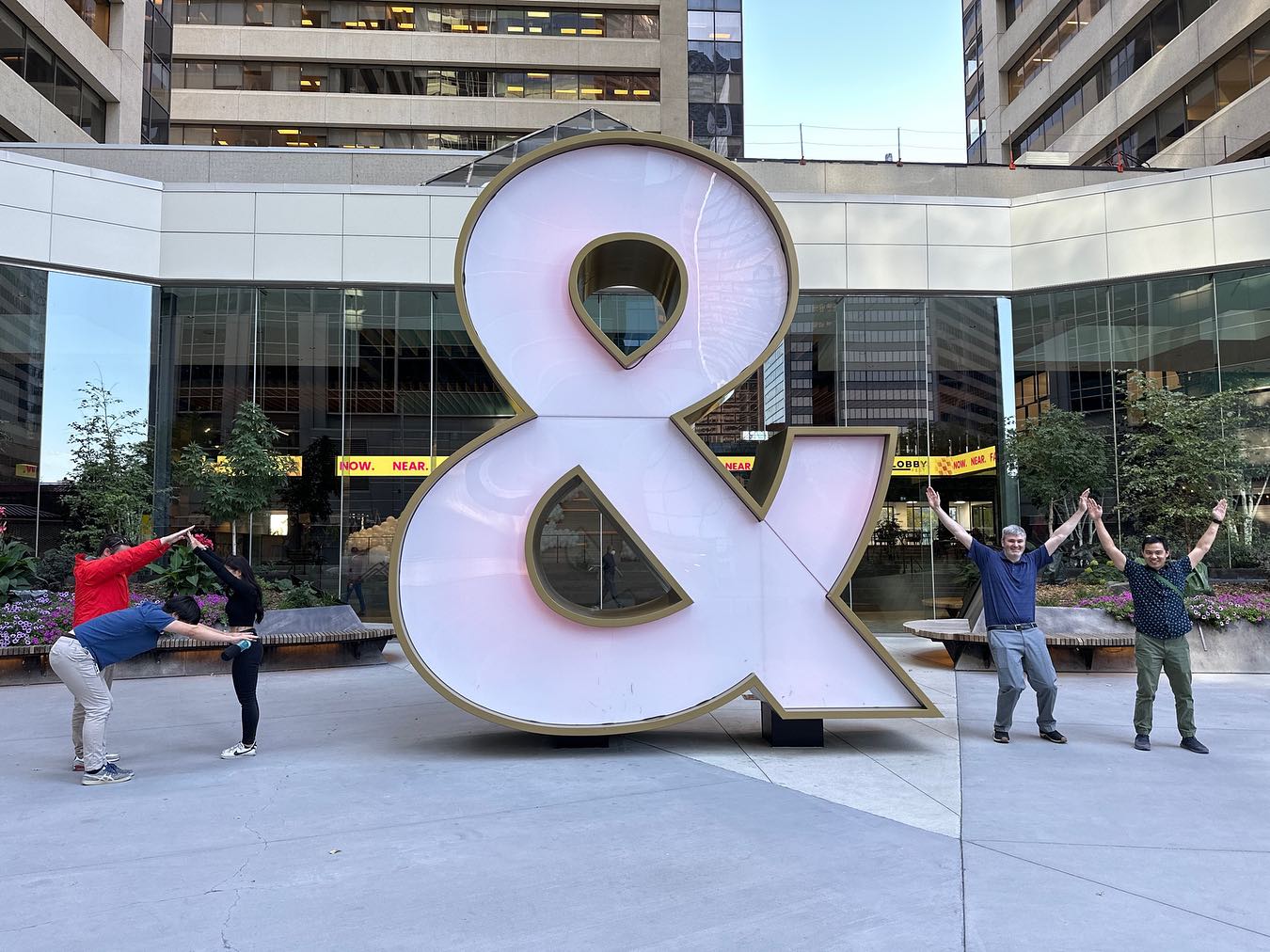 Teams showing off their creativity in Calgary, when challenged to use the urban landscape as part of their adventure. Can you see the company names they have visually represented?#calgaryteambuilding #teambuilding