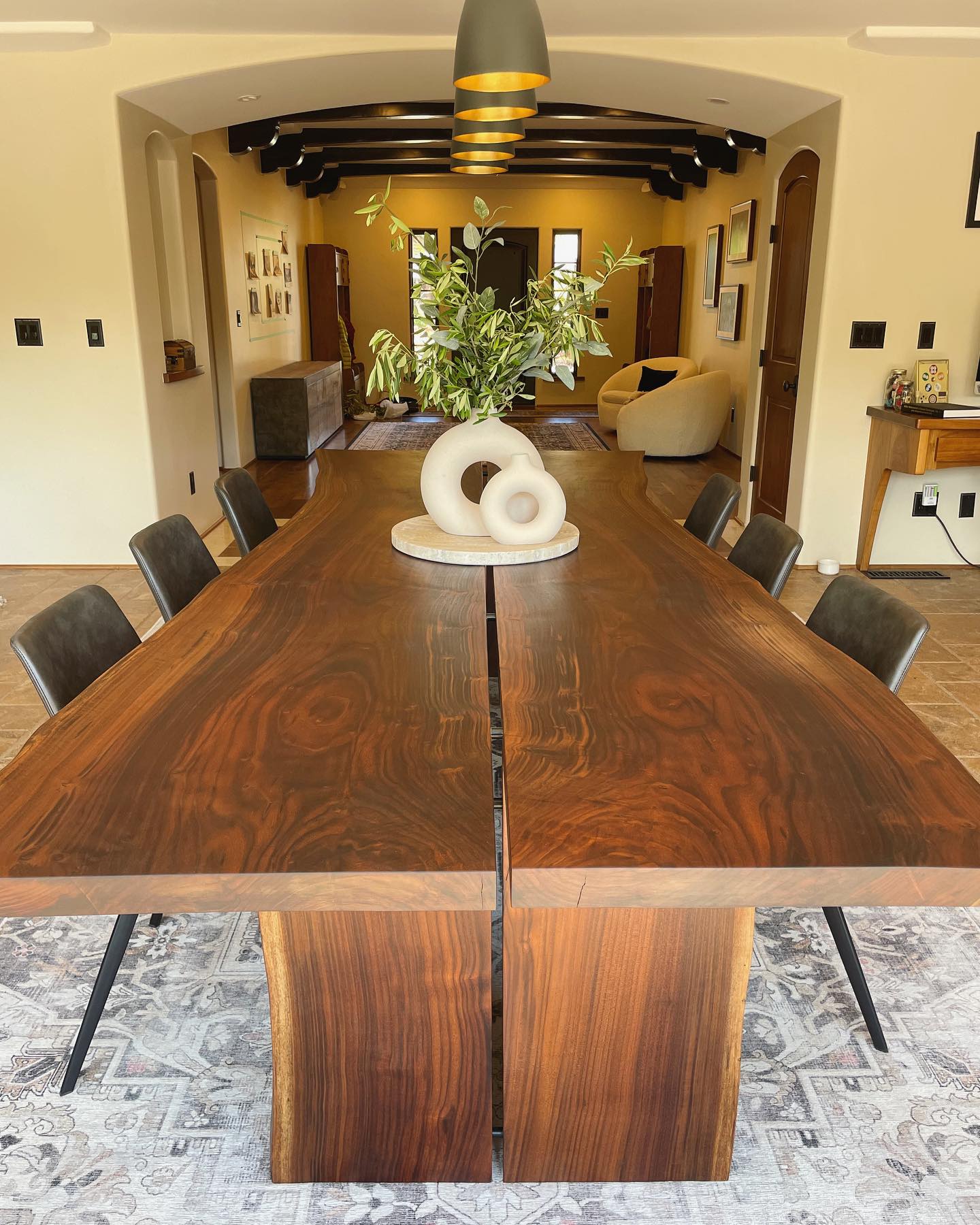 This was an interesting project from a few months back. These slabs were branches from a Claro Walnut tree in King City. There were birds roosting in the tree and leaving droppings on a farmers produce so the tree was cut down. There are steel rods connecting the book matched slabs, leaving a unique reveal down the center.
Interior design by @atlas_designinteriors