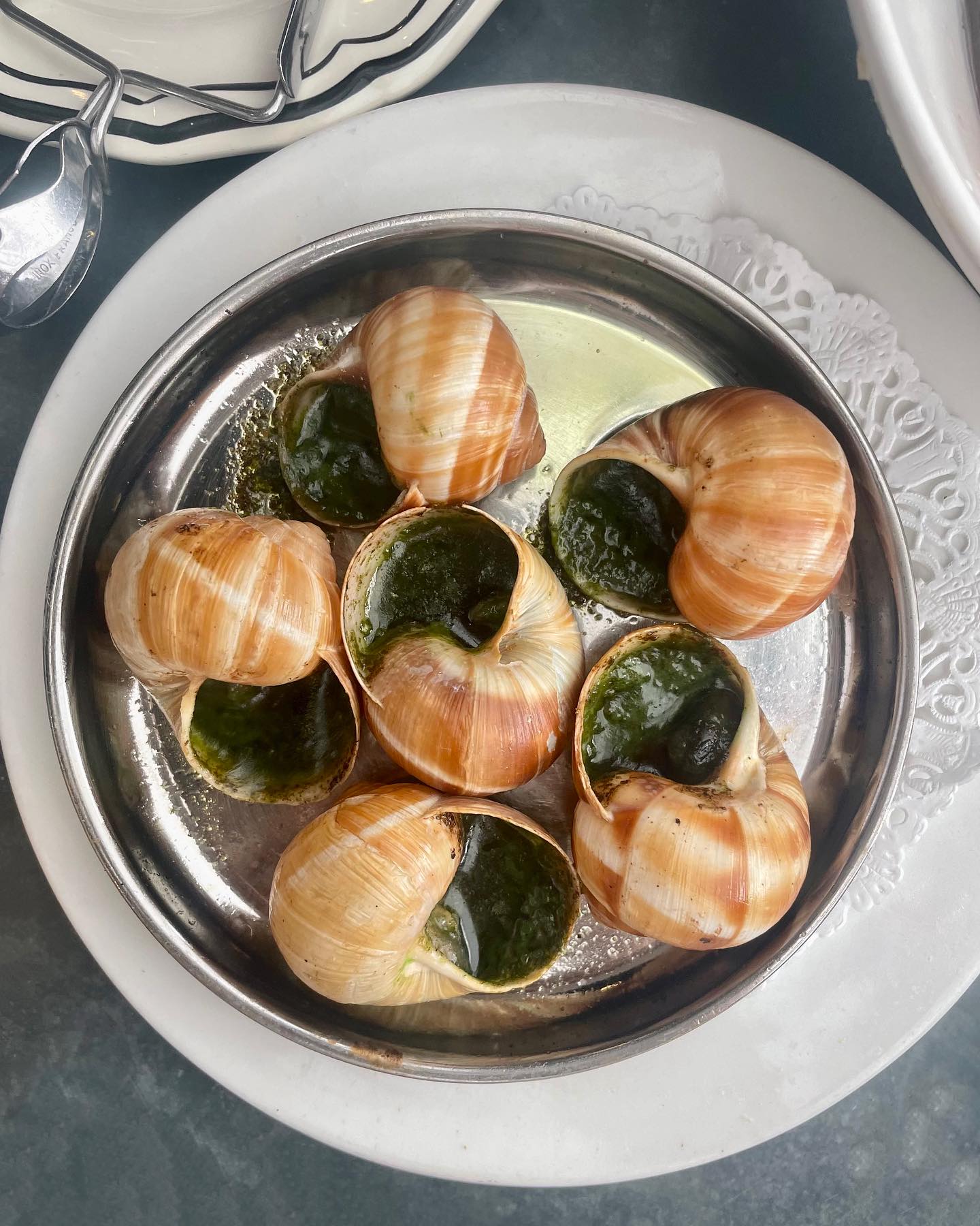 I always like to push myself to try to something new whenever I am traveling, so this trip to Paris I decided to try escargot for the first time. I’ll be honest… I was very hesitant to try them, but I actually ended up loving them! Of all the places I tried escargot, @les_antiquaires_paris was definitely my favorite! If you have never tried snails, think of them as kind of like the texture of clams or mushrooms with a lot of butter, garlic, and pesto.
At Les Antiquaires, I also had a delicious Linguine al Vongole (pasta with clams, tomatoes, white whine, garlic, and parsley). I love to squeeze a good amount of lemon juice on this dish to make it even more amazing 😊
I was also so excited to see that this restaurant had one of my favorite drinks that I can only ever find in Europe, which is apricot juice (if you know if somewhere I can get this in the US and that is actually good, please, please, please tell me!!)
Click the link in my bio to learn more about my favorite places to eat in Paris ❤️
#myhealthfullife #RD #RDN #RegisteredDietitian #health #healthy #healthyfood #healthylifestyle #food #foodie #nutrition #eatclean #foodblogger #lifestyleblogger #blogger #blog #foodinspiration #healthinspiration #paris #france #parisguide #escargot #snails #lemon