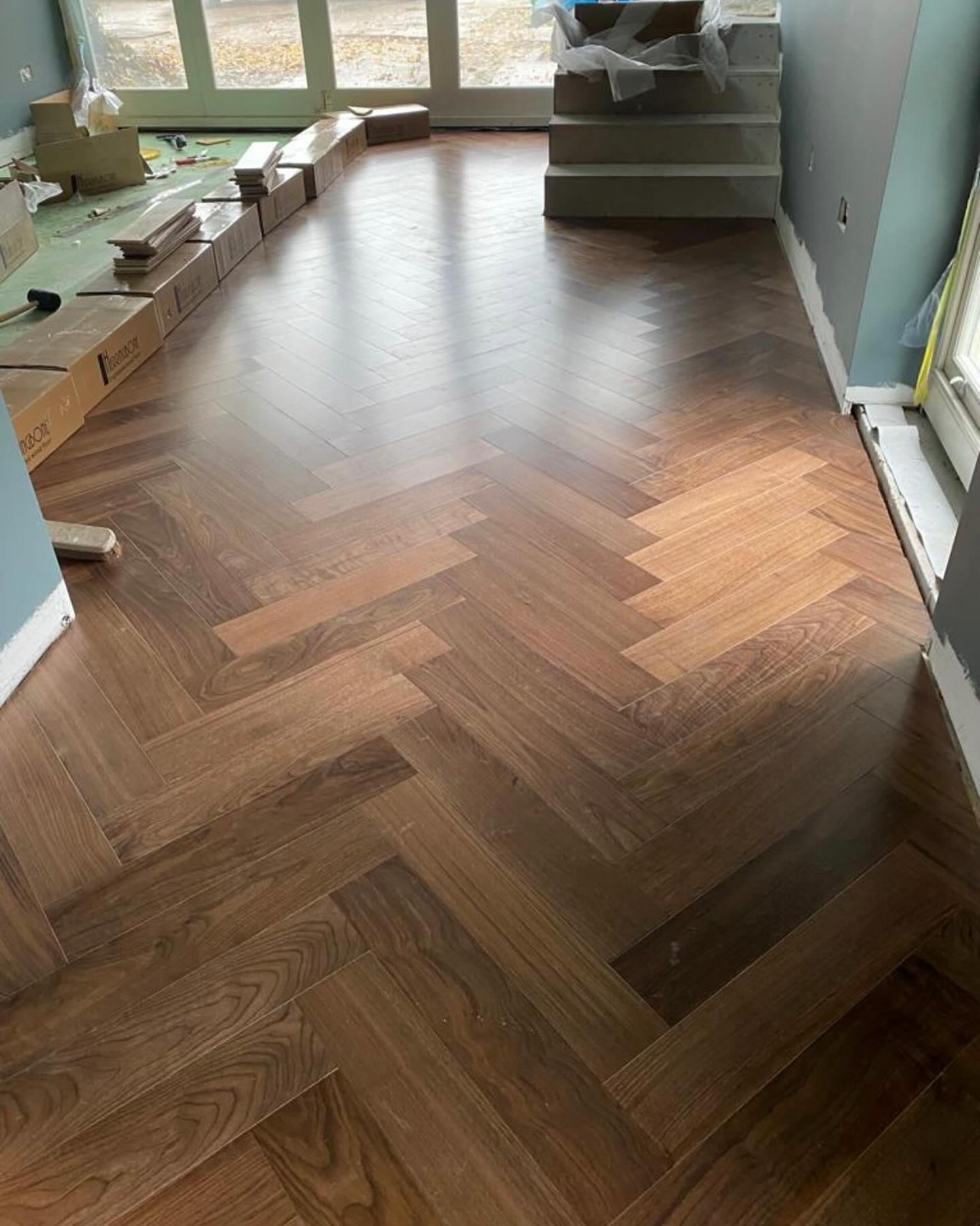 Work in progress! 120m2 Walnut Engineered Flooring in a Hertfordshire home.