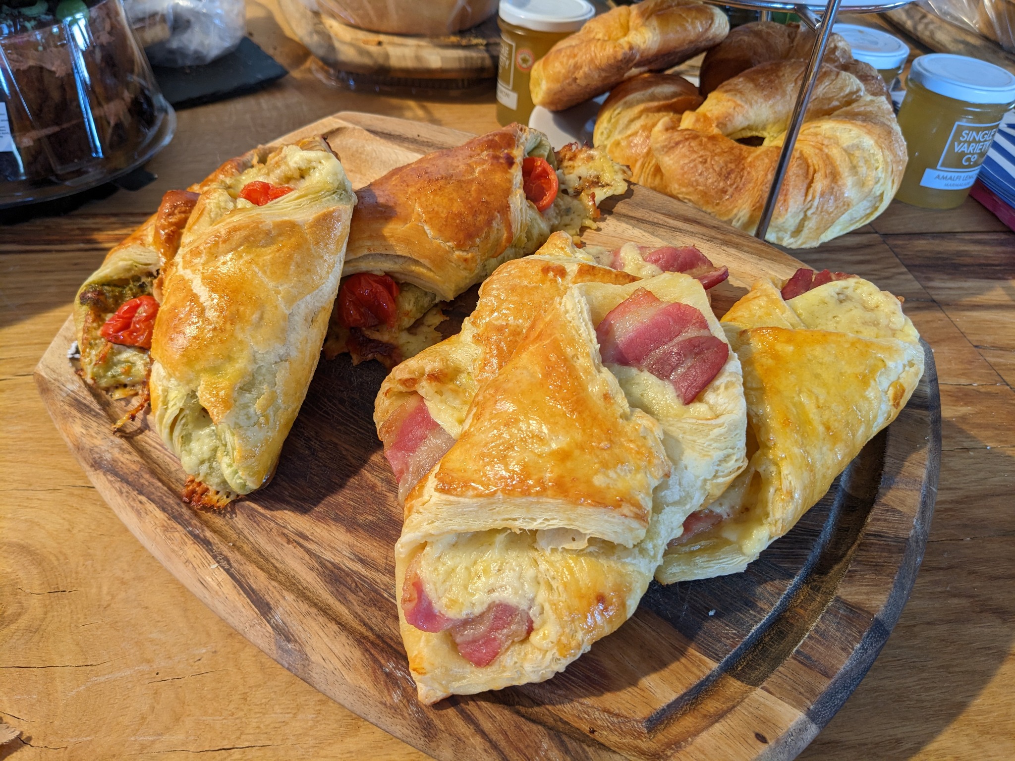 Fresh out of the oven this morning! Bacon and cheese or pesto, cheese and tomato breakfast parcels, get them while they are hot (and before we eat them all, 2 have already “gone missing”)!