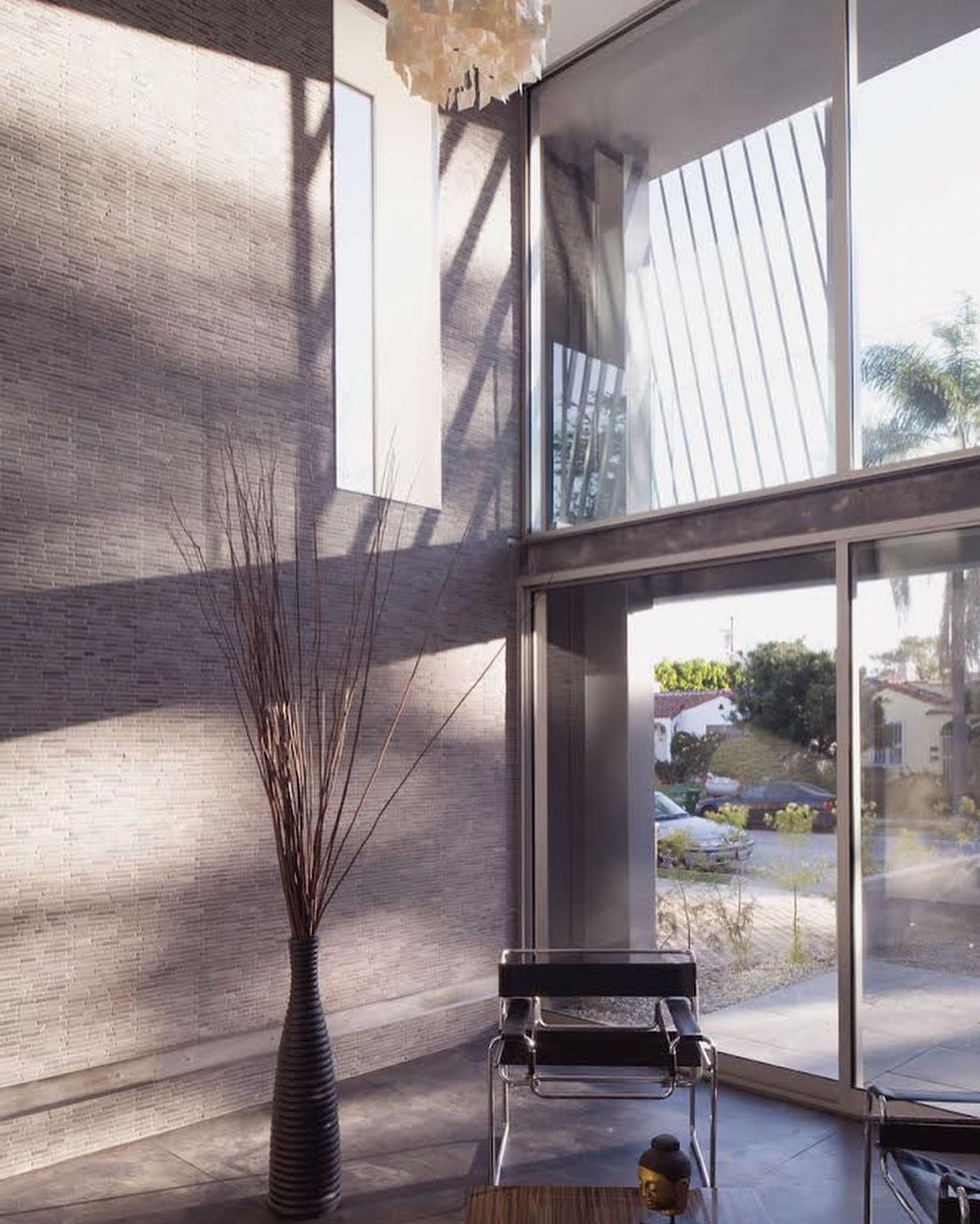 At Sander Architects, one of our super powers has always been our use of materials. In this project we used recycled, eco-friendly steel, tile, concrete stain -- and then included some of the coolest stairs we have ever designed. We do love designing stairs. For more, see www.sander-architects.com/green-houses