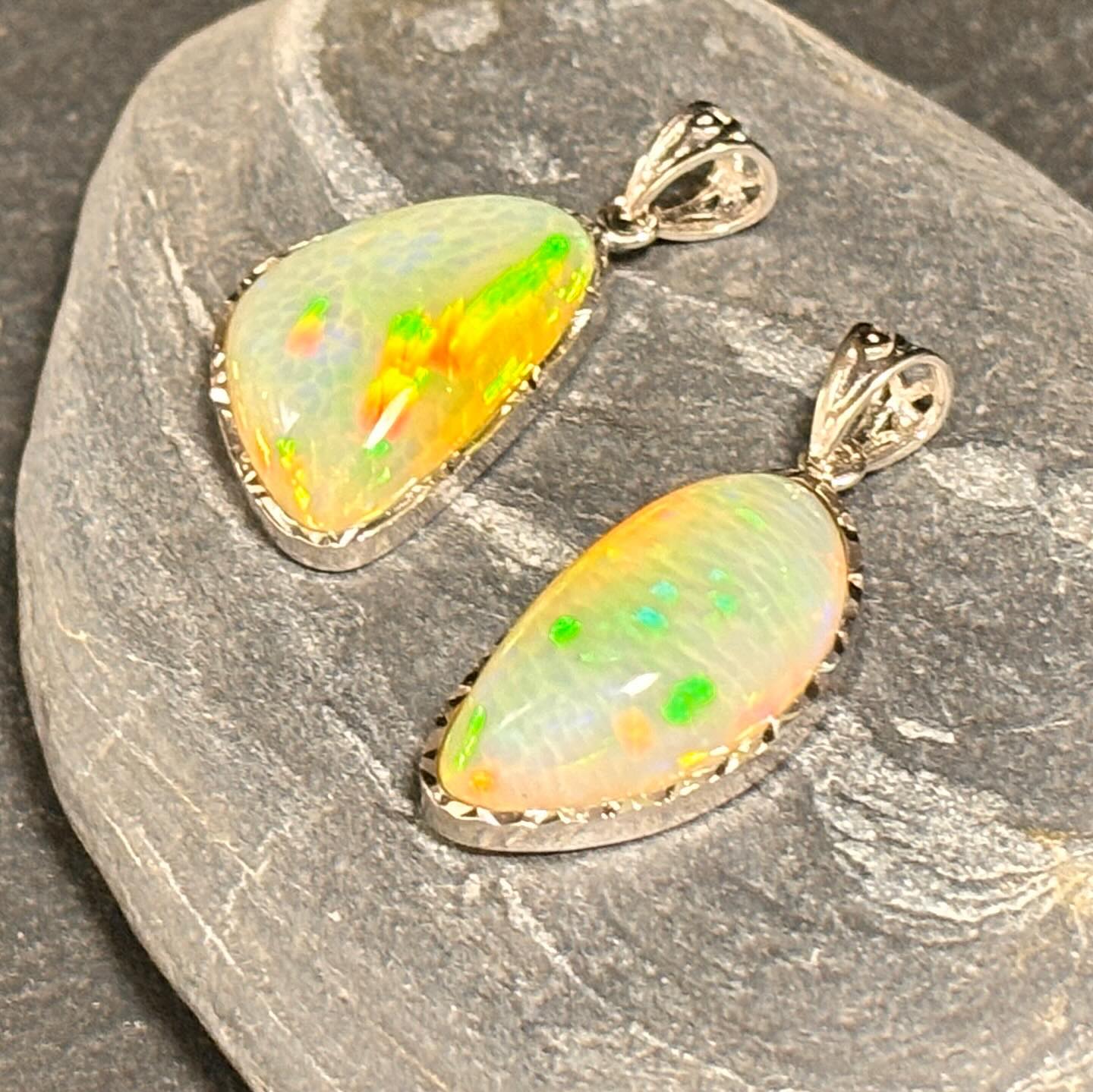 Opal pendants with s925 silver. . Left: 22.4x15x7mm,11.45ct
Right 24.6x12.6x8.5mm 12.94ct