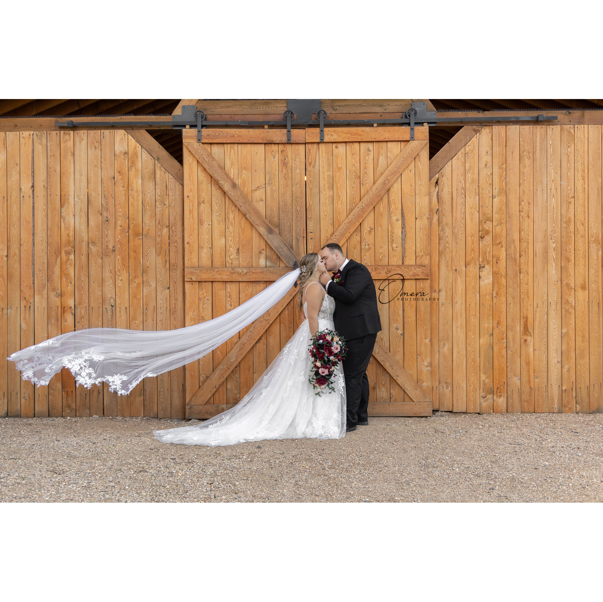 A sneak peek for this lovely couple!
I absolutely live for a cathedral-length veil and a waterfall bouquet! All of the details for this special day were so beautiful! And despite the intense wind, they had a gorgeous sunny day to celebrate their union. The weather meant we had to find some wind cover and shade, and this barn door was the perfect backdrop!