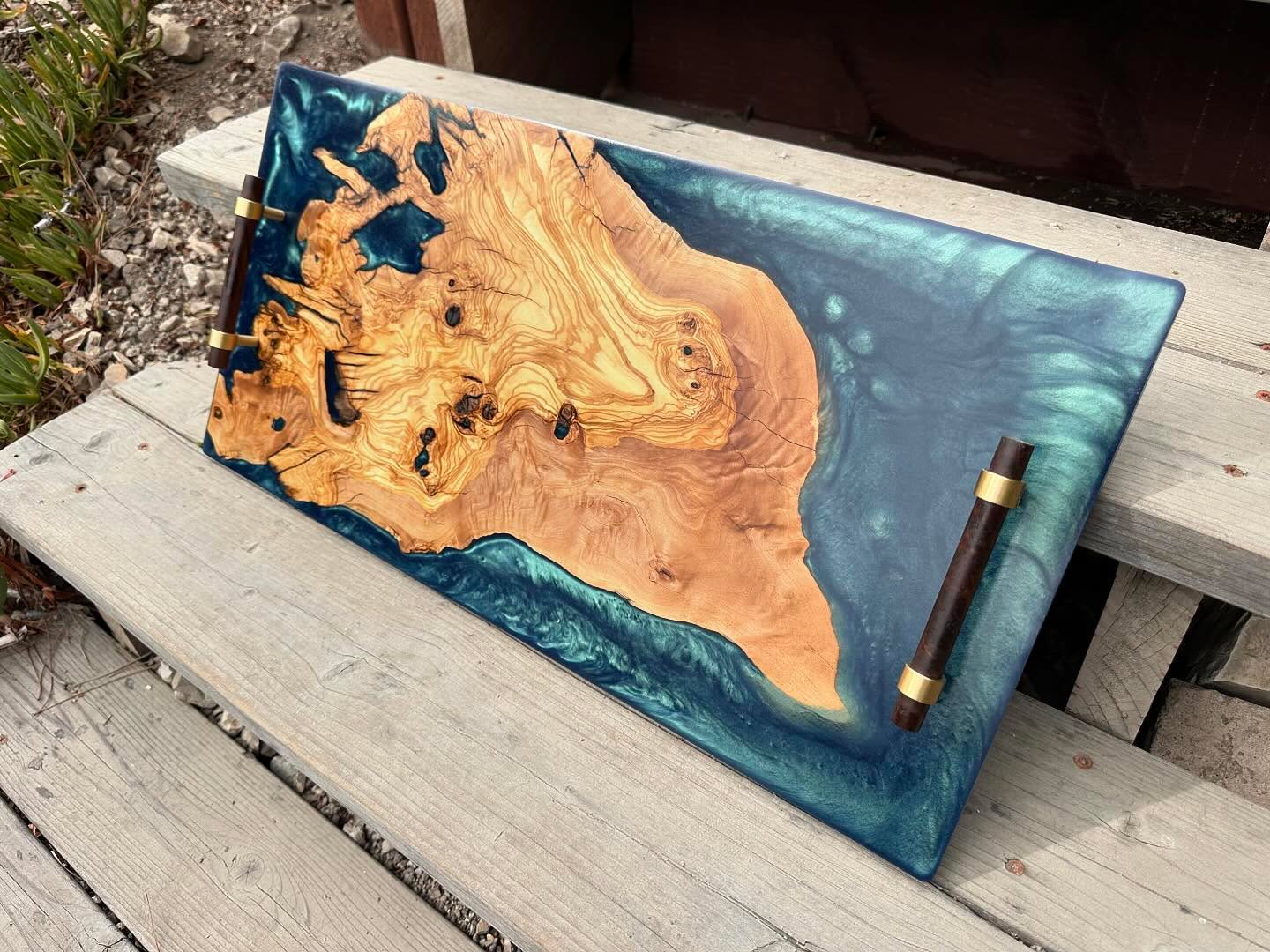 Live edge olive and mermaid blue resin with walnut and brass handles. 24 inches by 12 inches.