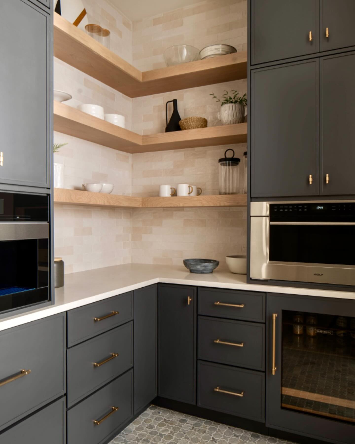 We wanted to share one of our favorite places off the kitchen in our Jenna Ct project. #butlerspantry #moodycabinets #builtinappliances #skinnyshakercabinets #openingshelving #customcabinets #designercabinets #interiordesign #kitchendesign #kitchencabinets #modernkitchens