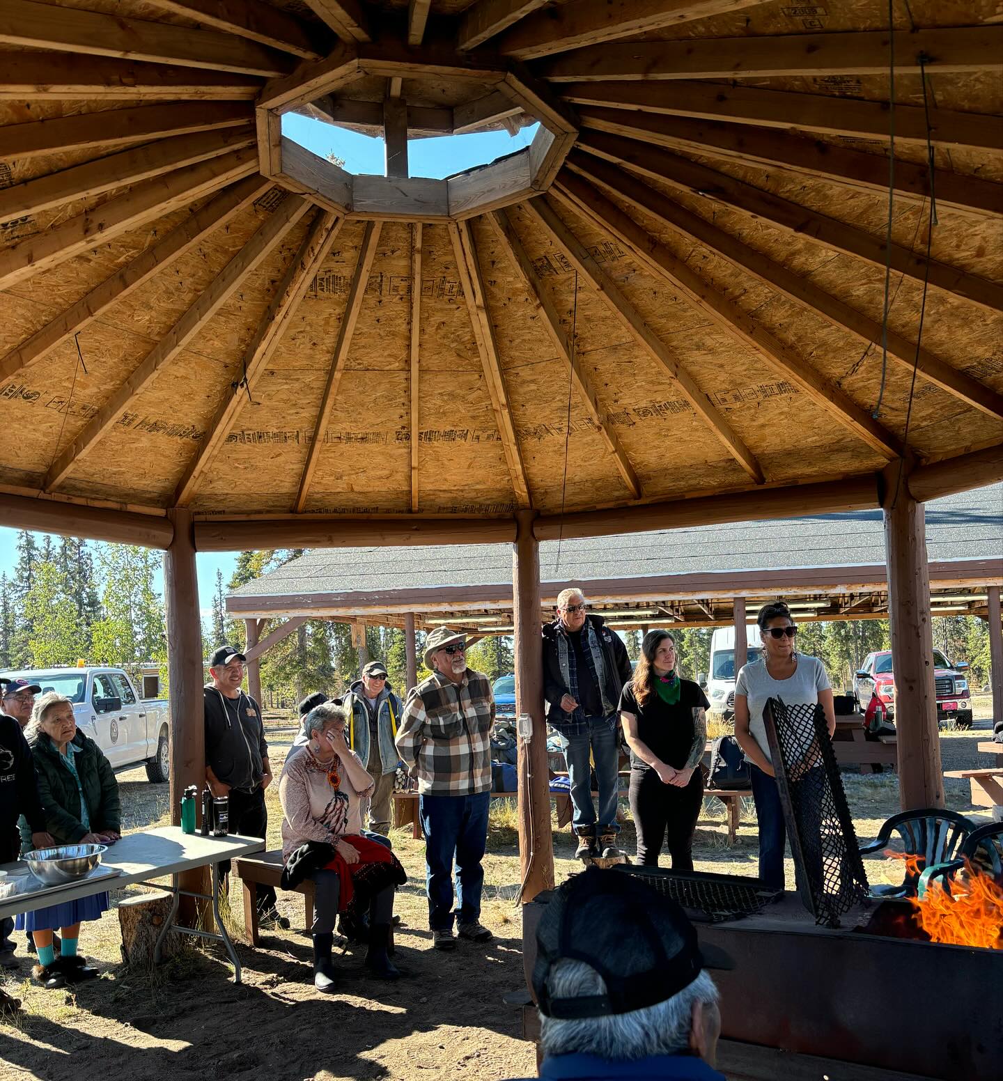 Lead Wildlife Biologist, Orna Phelan, was thrilled to attend the Caribou Guardians Coalition on the land gathering in Wekweètì, alongside NSMA elders Wayne Mercredi and Lawrence Mercredi. The Caribou Guardians Coalition is an organization that aims to foster collaboration between existing Indigenous guardianship programs and support the establishment of new ones to collect data and information pertaining to the critically declining Bathurst herd of barren-ground caribou. The vision statement of the CGC is “Current and future generations of Caribou People working together to guard and respect caribou and the land they need to thrive”. The NSMA has been a part of the CGC since it’s inception in 2020 and has seen the organization bring together Indigenous people from all over northern Canada, to share information about what they’re seeing across the herd’s range, and identify ways to improve habitat and increase the herd’s size.
During our time in Wekweètì, we heard updates from other Indigenous governments and organizations about their guardianship programs and the results they are achieving. We engaged in important discussions on hunting practices and traditional laws. Beyond addressing these critical topics, we gathered around the fire to share caribou stories and legends. This gathering was a unique experience because we were able to get together on the land, rather than in a boardroom or office, allowing us to connect in a place where caribou roam. Unlike typical workshops where participants return home at the end of the day, here we shared meals, exchanged stories, and discussed caribou. We were also fortunate to be taken on a trip around the lake by Tłı̨chǫ elders and community members who shared some incredible history about the area and pointed out historic caribou water crossings.
Overall, this gathering was a remarkable opportunity to learn from other guardian programs and build meaningful relationships. We are so grateful to the CGC and newly appointed executive director Amos Scott, for inviting the NSMA to participate and we want to extend our warmest thanks to the community of Wekweètì, in particular former chief Joseph Judas, for the incredible