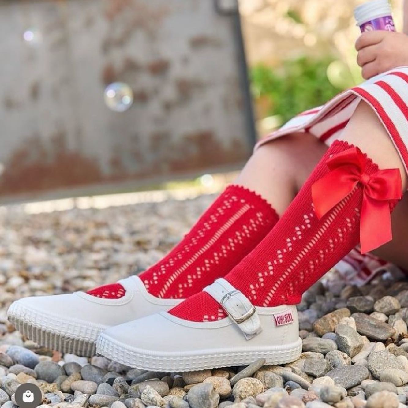 CARLOMAGNO open work socks with satin bow are available in over 20 beautiful colour ways! With a 1,200โฌ spend you could benefit from a free display stand. Style 2141 is priced at 3,15โฌ- competitive prices for high quality socks made from Scottish yarn. #socks #tights #summer #colourful #bows #spanishbabywear