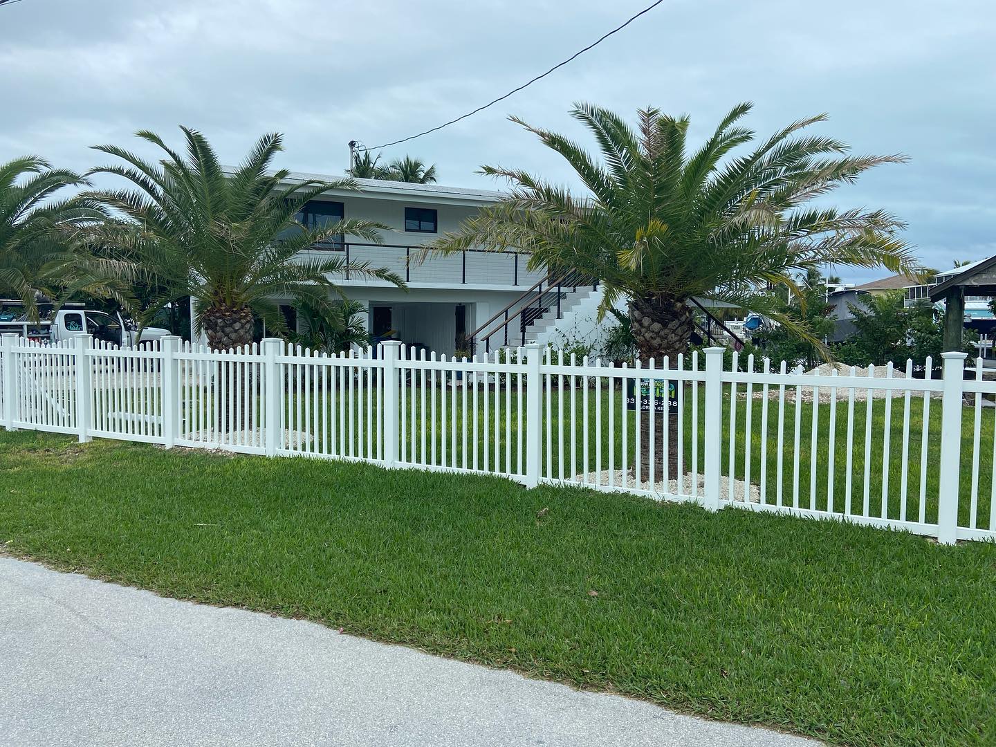Customized P.V.C. Fencing with an exact matching Aluminum rolling gate in Islamorada. Customization is our specialty. Great job crew! #keysfencing #keylargo #fencing #floridakeys #customhomes #aluminumfencing #pvc
