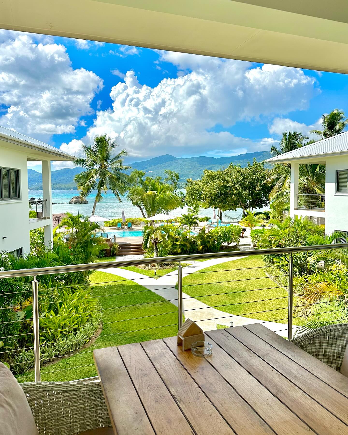 Paradise: where tropical gardens meet the soothing embrace of the ocean. 🌴🌊 #HeavenOnEarth #NaturePerfection"