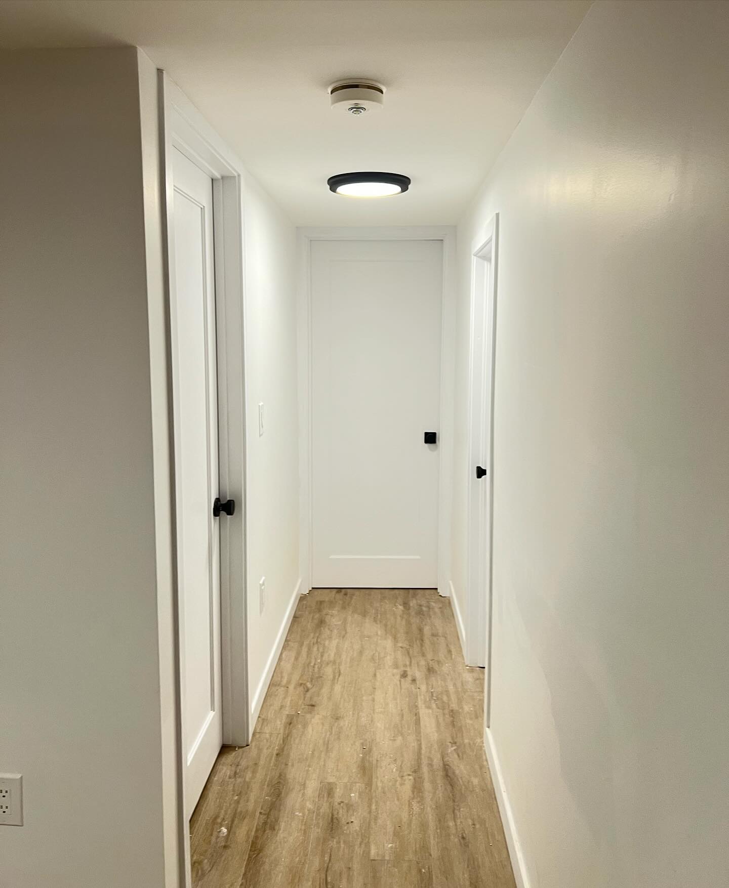 2 bedroom basement rental unit complete gut and renovation in Toronto! - hallway solid wood one panel doors #renovation #constructiontoronto #contractorsofinsta #toronto #basementdesign #basementremodel #kitchenrenovation