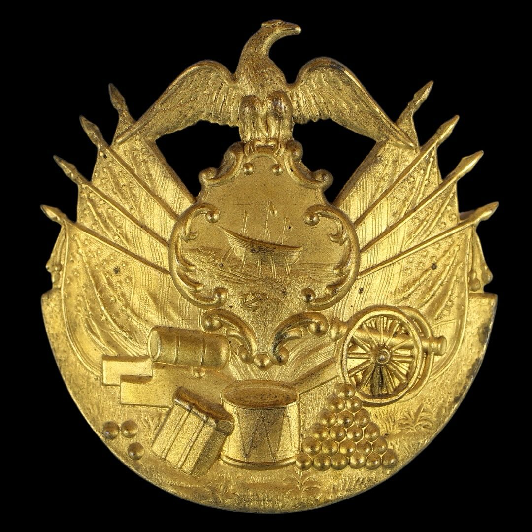 Just sold but had to share this New Hampshire gem!
An incredible hat plate dating back to the time of the Mexican War, designed specifically for New Hampshire. These plates were crafted between 1840 and 1845 and remained in use thereafter. The plate showcases a Union eagle at the apex, a depiction of a ship being built below it, as well as draped flags on either side, a drum, a backpack, and a collection of cannons, mortars, and cannonballs.
#newhampshire #antiques #americana #historical #mexican #american #military #usmilitary #eagle #cannon #patriotic #memorialdayweekend #gallery76americana