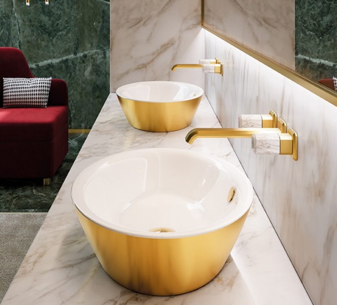 If your vision for a bathroom is one of elegance and opulence, a white and gold palette offers the perfect balance. The crisp, luminous white infuses the space with light and openness, while the radiant gold accents add a touch of warmth and luxury. Together, they create an atmosphere that is both sophisticated and timeless, with a clean, fresh aesthetic that remains a classic choice for those seeking enduring style in their bathroom that will stand the test of time. Inspired by the artistry of high jewelry, these exquisite products draw their rich metallic allure from 18k gold. @ceramicacatalano #luxury #interiordesign #design #bathroom #bathroomdecor #homedecor #bathroomdesign #faucet #bath #bathroom #bathroomdecor #bathroomdesign #bathroomgoals #bathroomideas #bathroominspiration #bathroomremodel #bathroomreno #bathroomrenovation #bathrooms #lighting #homeimprovement #parisontario #stgeorge #brantford #brantfordontario #simcoe #waterford #woodstockontario #cambridgeontario #lightingdesign #dundasontario #hamiltonontario