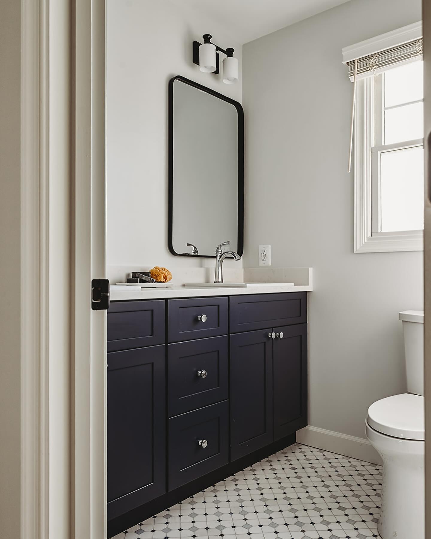 We’re giving all the behind the scenes details complete with before and after pictures of our #transitionalfarmhouse project on the blog, 🔗 in profile. We worked with our client for over a year to completely redesign their home after a devastating house fire.
We love the playful tile and navy vanity in the kids bathroom. To maximize every inch of space we did a custom depth vanity for this family with 3 young kids. Swipe to see before.
Design || @hillhousedesignmd
Photo || @brittanydunbarphotography
#hillhousedesignmd #traditionalwithatwist #baltimoredesigner #homeredesign #kidsbathroom #bathroomdesign #navybathroom #beforeandafter #designdetails