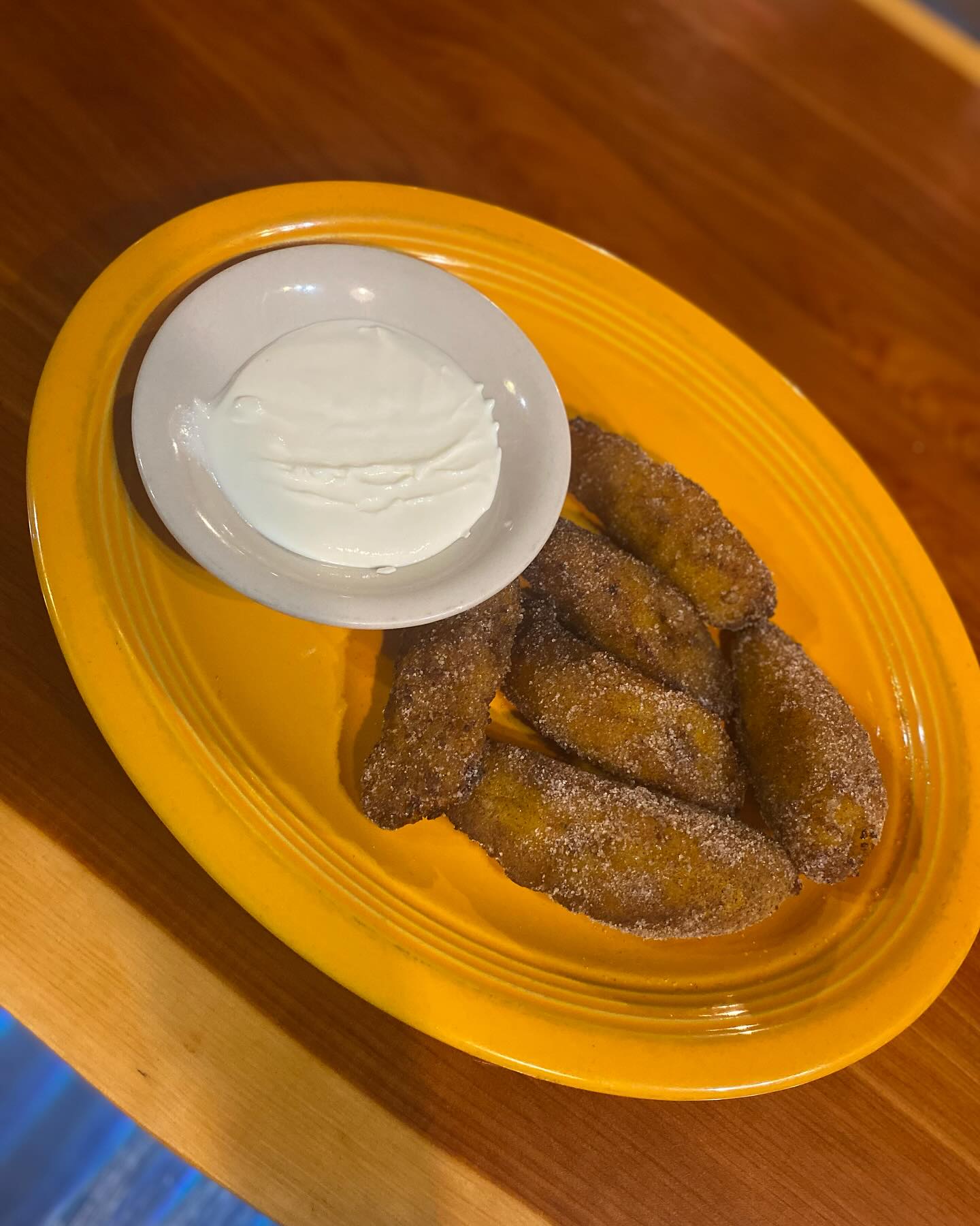 Come over and try these amazing plantains covered with cinnamon sugar and sour cream in the side!!