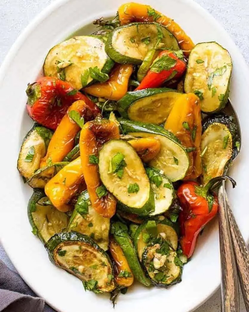 This weeks recipe is: Sweet Peppers And Zucchini Salad 🥗
Ingredients:
- 1 lb sweet peppers (approx. 3 sweet peppers)
- 2 zucchini sliced diagonally to ¼ inch slices
- 3 cloves garlic finely minced
- ½ bunch fresh parsley chopped
- ½ bunch fresh cilantro chopped (optional)
- 2 tablespoon Balsamic vinegar
- 7 tablespoon grapeseed oil or olive oil
- ½ teaspoon salt
- ¼ teaspoon pepper
Instructions:
- Heat 3 tablespoons of oil in a large pan and on a medium heat.
- Add sweet peppers and cook stirring frequently until slightly softened and browned on the sides, about 7-10 minutes. With a slotted spoon transfer the peppers into a medium bowl.
- To the same pan, add zucchini and cook for about 5 minutes until softened. Don’t overcrowd the pan. You might need to cook in batches.
- Transfer cooked zucchini to the bowl with the sweet peppers.
- Add garlic, parsley, cilantro, vinegar, remaining 4 tablespoons of oil, pepper and salt to a small mixing bowl and whisk until all ingredients are incorporated.
- Drizzle cooked vegetables with a parsley and cilantro dressing and serve.
Recipe adapted from: https://www.lavenderandmacarons.com/georgian-salad-baby-sweet-peppers-zucchini/#recipe
#Pactprogram #growtolearn #urbangardening #communitycookbook #saladrecipe