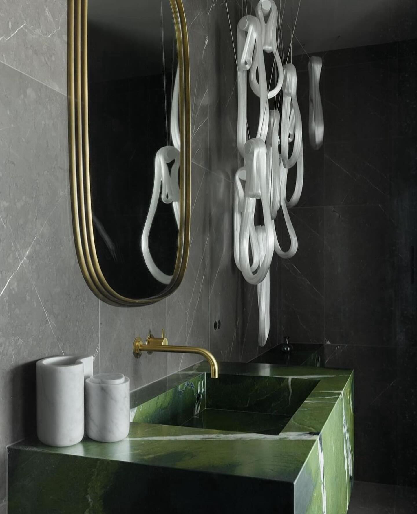 The new era of powder rooms is all about embracing bold, unapologetic designs that defy tradition. Exquisitely veined marble, deep, saturated hues, gold accents, and a striking light fixture @bocci come together with intimate details to create a space that feels both luxurious and daring. This jewel-box powder room shows that, more often than not, it’s the smallest rooms that leave the most lasting impressions. #fixturesinspiration :@falkenreynolds #luxury #interiordesign #design #bathroom #bathroomdecor #homedecor #bathroomdesign #faucet #bath #bathroom #bathroomdecor #bathroomdesign #bathroomgoals #bathroomideas #bathroominspiration #bathroomremodel #bathroomreno #bathroomrenovation #bathrooms #lighting #homeimprovement #parisontario #stgeorge #brantford #brantfordontario #simcoe #waterford #woodstockontario #cambridgeontario #lightingdesign #dundasontario #hamiltonontario