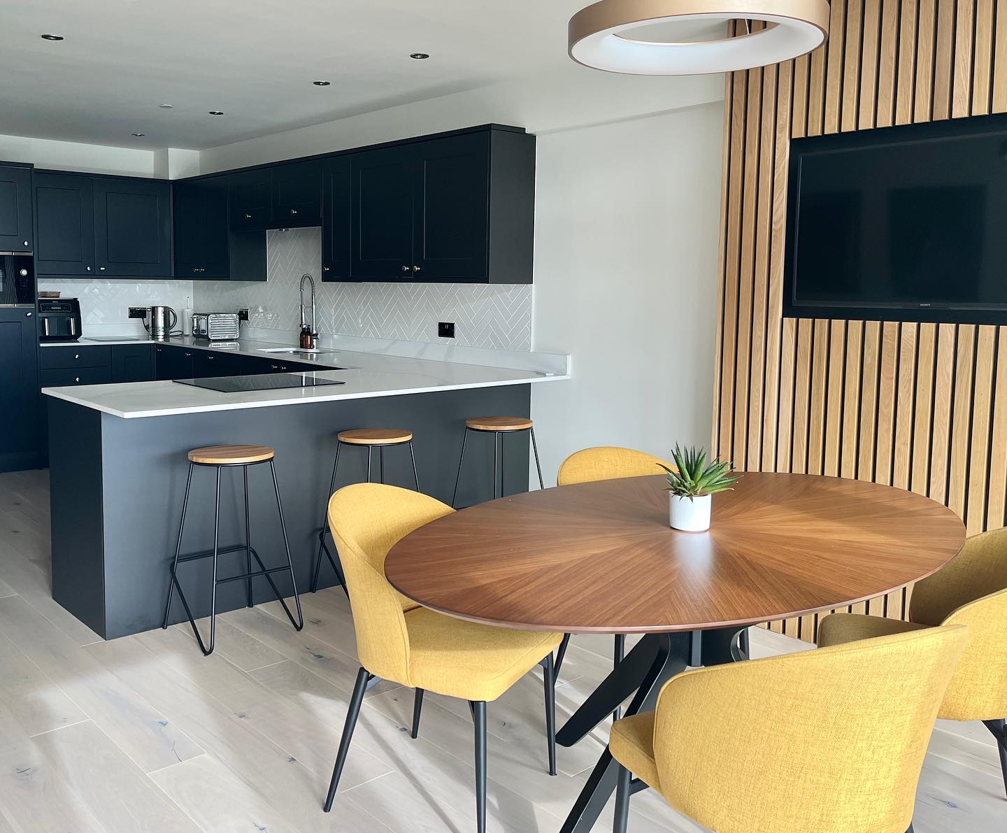 When my clients moved into their new property they were keen to put their own stamp on it and called me in to help. After designing the living room, we started work on the kitchen and firstly looked at how the layout could be improved. My clients are lucky enough to have really cracking view of the Tay Bridge so it made sense to incorporate a peninsula with hob facing the window. Now I’m a totally rubbish cook but I think even I’d feel inspired to get cooking whilst looking at that view!
My clients wanted a smart, contemporary look so we opted for charcoal coloured cabinets, then added a bit of interest to the dining area with oak panelling and mustard yellow dining chairs.
They said they didn’t spend much time in the old kitchen so I was really delighted to hear today that they now love being in the new space. That made my day 😊. Swipe right for before pics.
Happy weekend all!