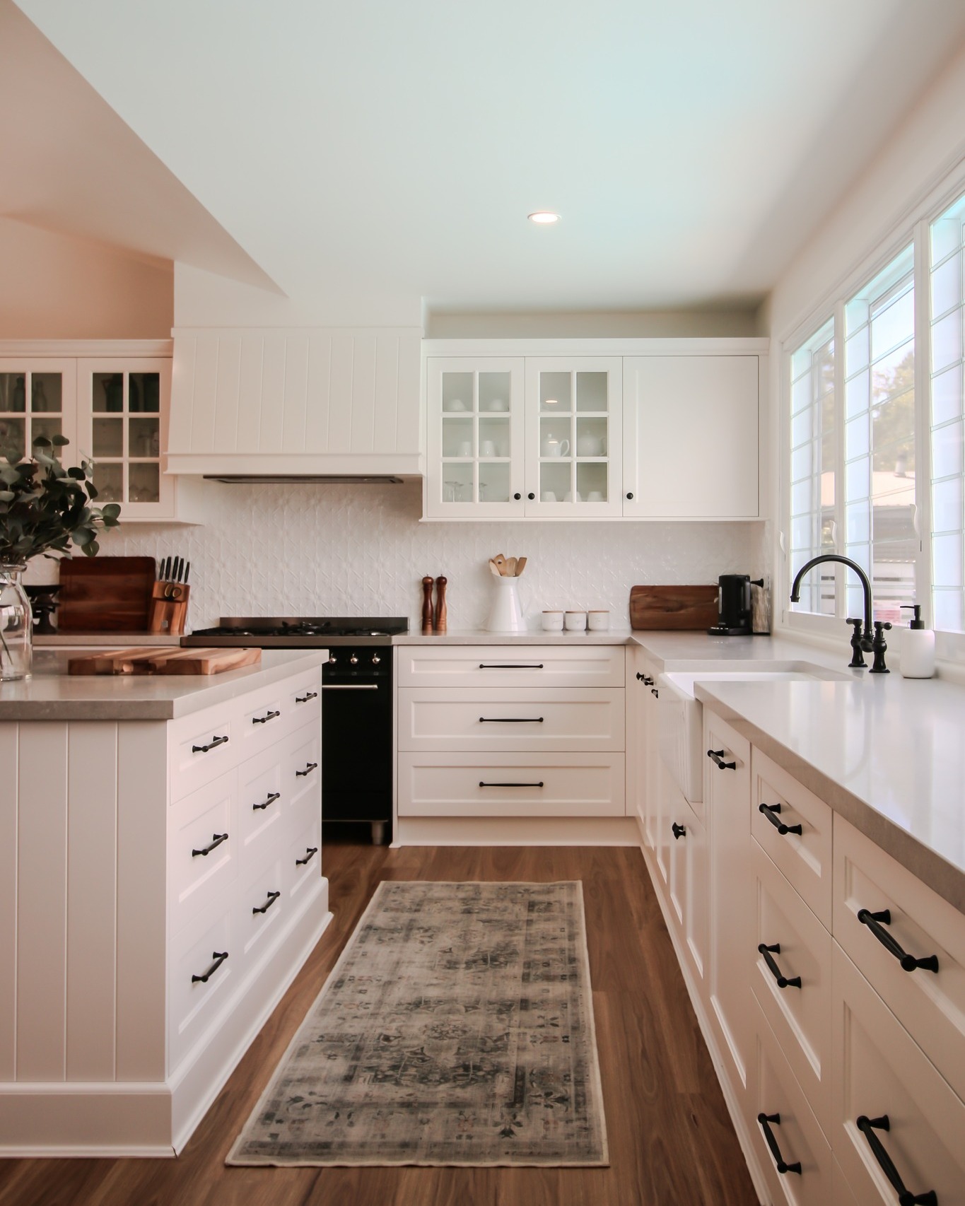 "Timeless elegance meets functionality ✨ A perfect blend of Shaker and V-Groove cabinetry, elevated by a striking pressed tin splash back. A kitchen that stands the test of time, where every detail tells a story of classic charm.