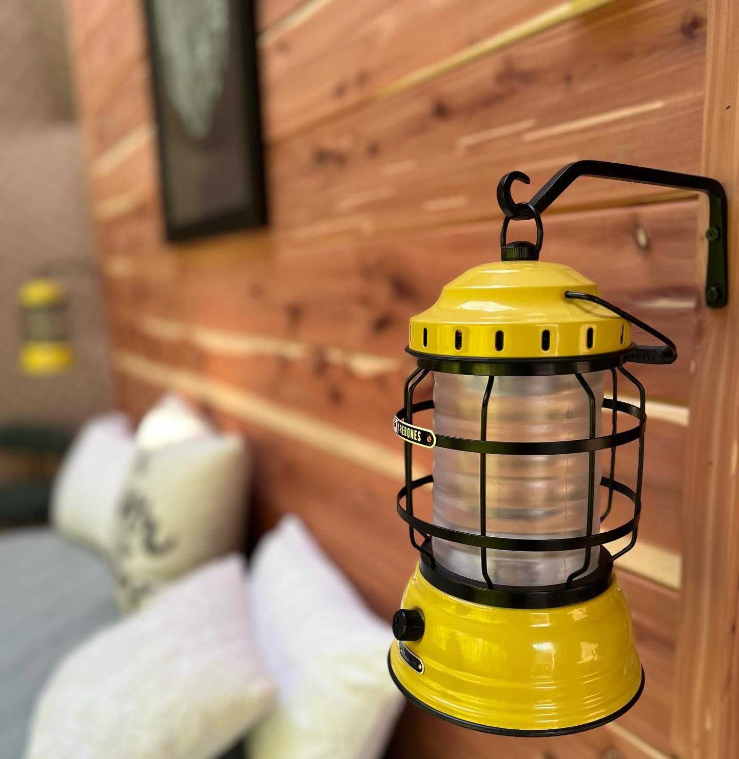 The @barebonesliving lantern in Honey Bee Way at TGL Adventures can be taken for a walk or to the hot tub for a cozy ambiance. Enjoy its subtle glow during a relaxing stroll or while unwinding on the deck, adding a touch of warmth and charm to your experience.
