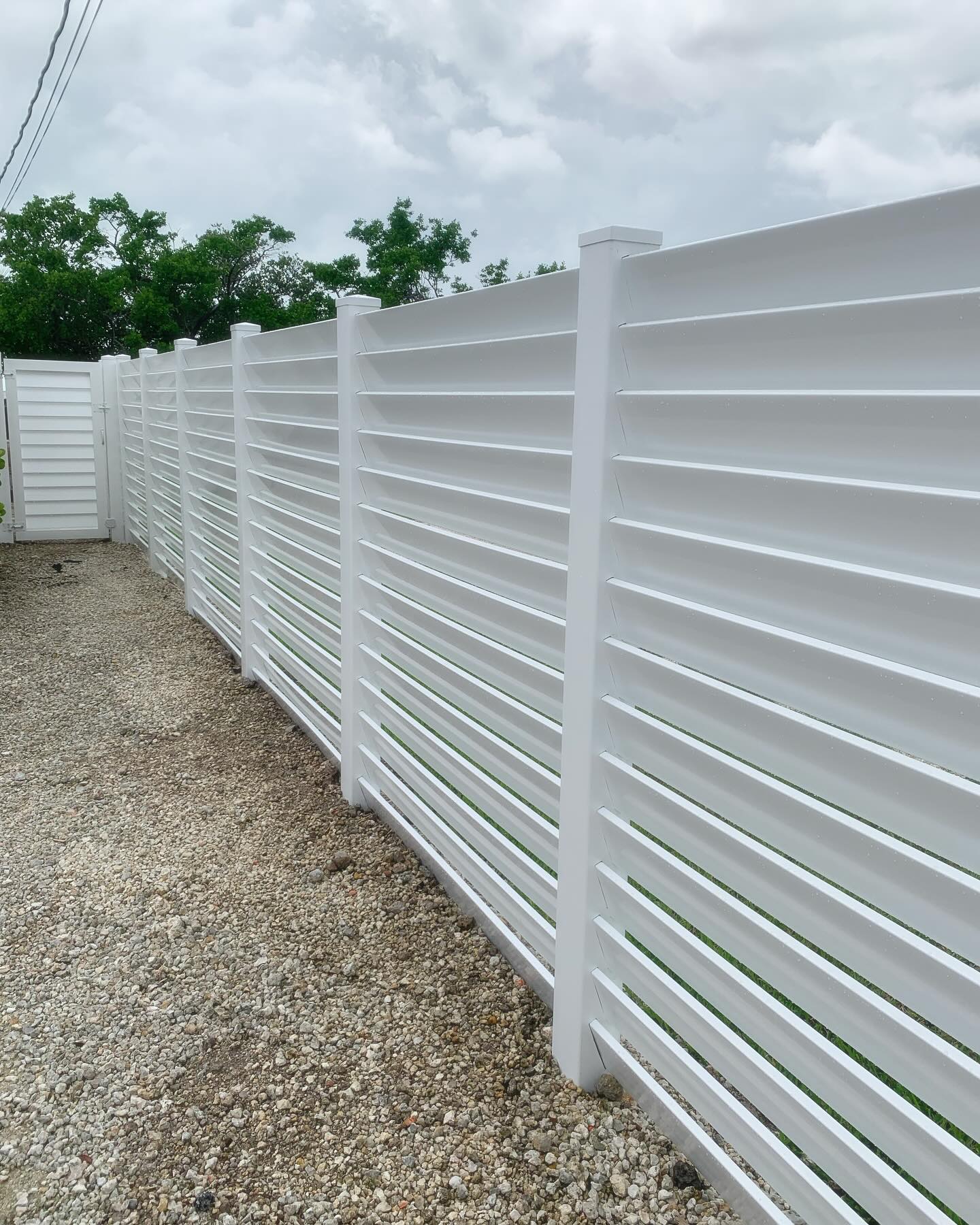 Privacy and ventilation = 6’ high Horizontal Louvered PVC fence. #pvcfence #privacyfence #knowafenceguy #knowafenceco