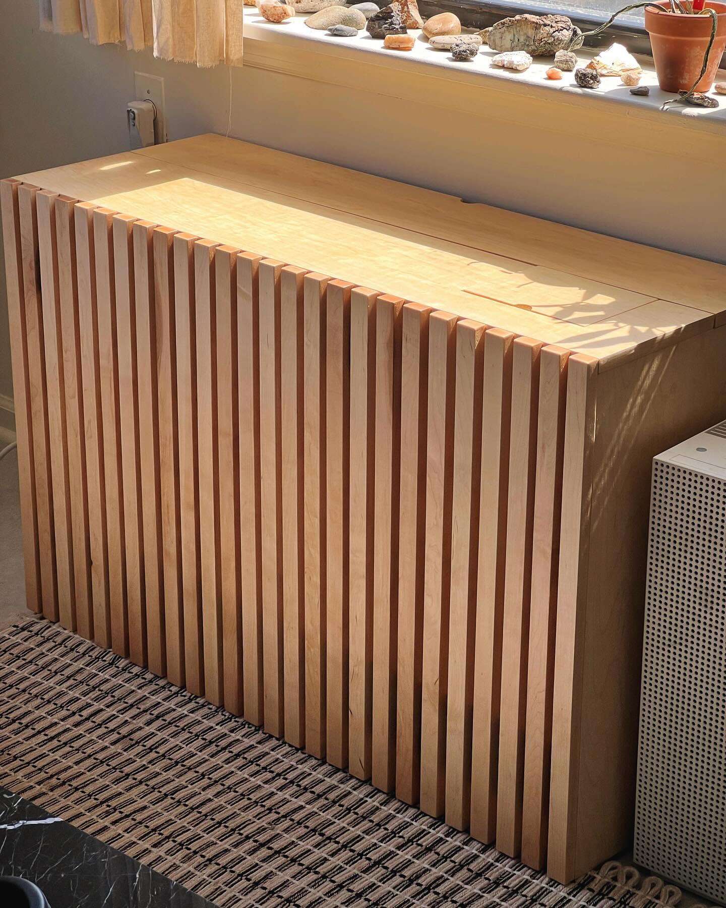 A couple weeks ago, we covered up this floor unit with a beautiful Maple slatted box. The fun (and challenging) parts of this build included incorporating holes for wires on each side and a U-shaped notch for a pipe into the design, navigating baseboard trim and utilizing hidden hinges to give the top a flat, seamless look while allowing easy access to filters and a control panel.
The devil was surely in the details for this build, but we couldn’t be happier with how it turned out 🛠️🪵✨
#pathdesign #pathdesignco #followyourpath #woodworking #woodfurntiure #furnituredesign #bespokefurniture #custommade