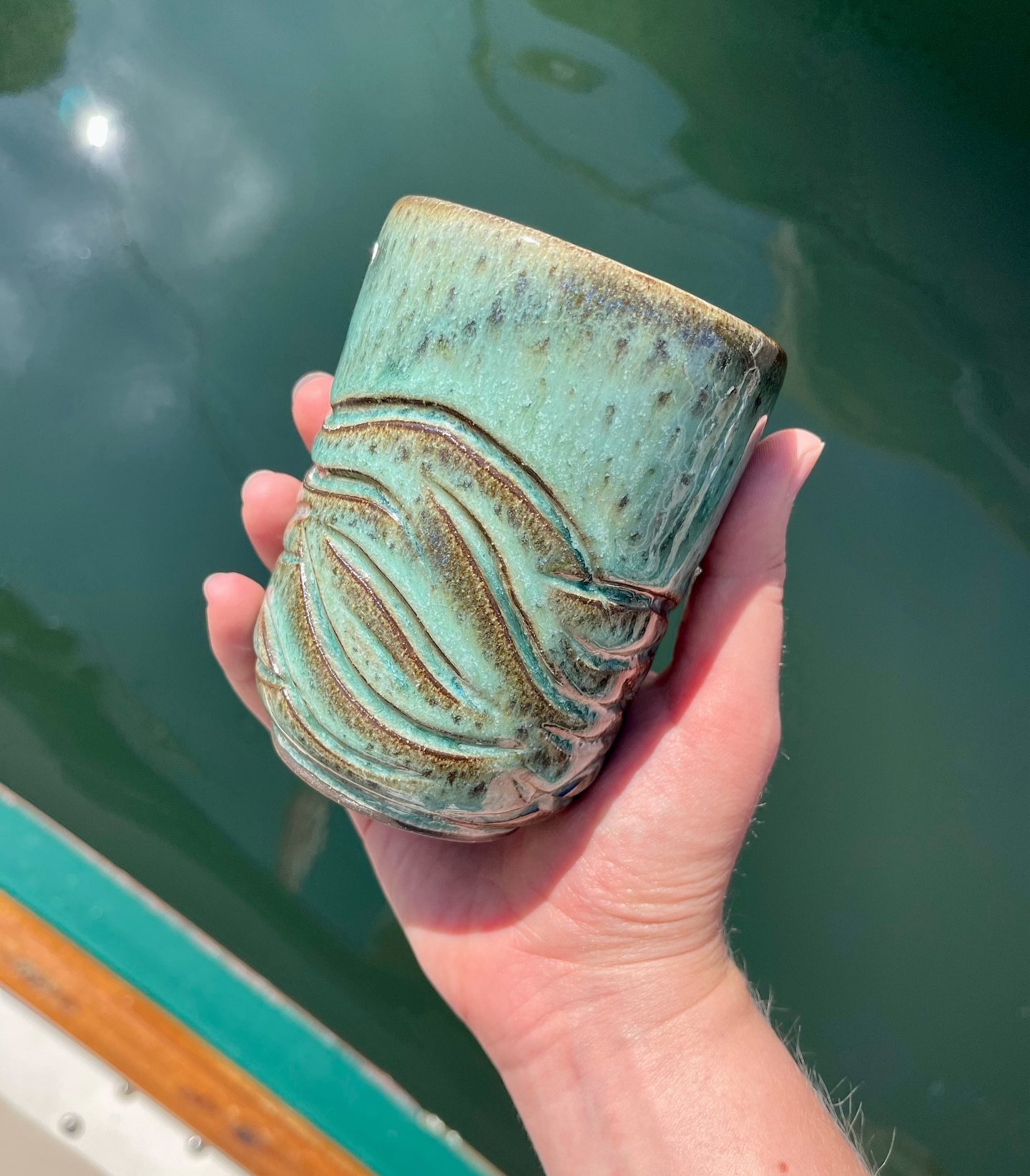 Many glaze combinations later, I finally found one that shows off the carving just right!