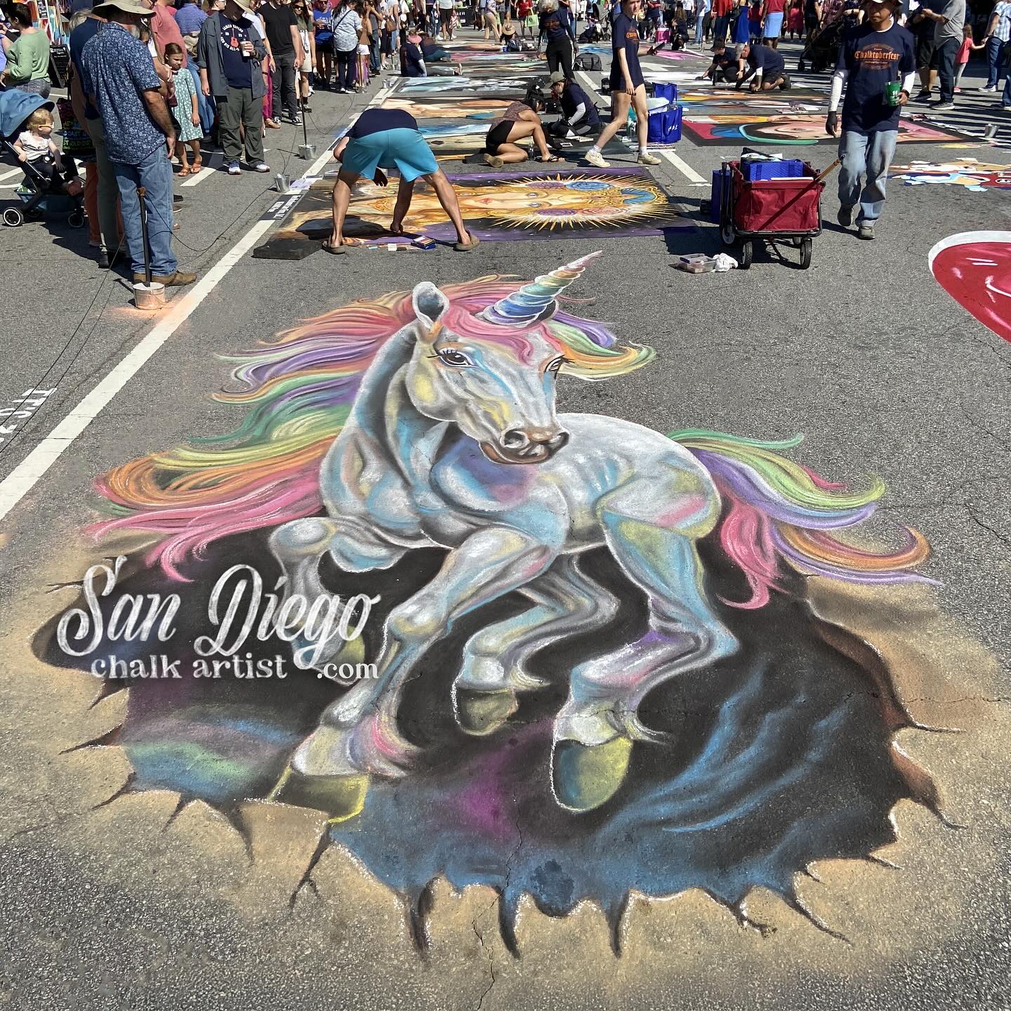 “Look mommy, a unicorn!”, said dozens of little kids at Chalktoberfest this weekend. Continuing my mission to do more 3D pieces this year… Revisiting the rainbow unicorn didn’t disappoint! Pic 1: Finished product. Pic 2: Photo of the distortion (it needs to be distorted to get the 3D effect to work). Pic 3: Detail of the work in progress. Pic 4: What it looks like after I lay out my base coat and stencil. Thanks for having me, @chalktoberfest see you next year!
#Chalktoberfest #Chalktoberfest2024 #3DChalkArt #3DChalkArtist #3DChalkDrawings #AnamorphicArt #Marietta #MariettaSquare #SanDiegoChalkArtist