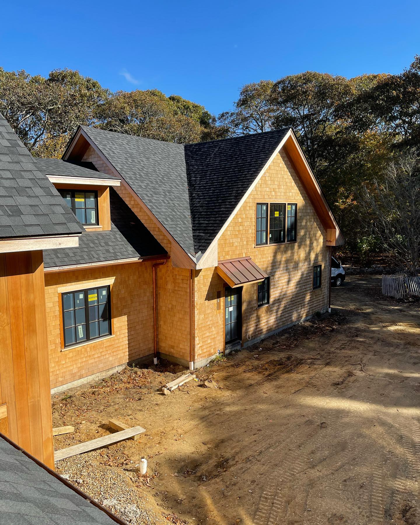 Courtyard view of our Lambert’s Cove Beach project. Luv the crisp blue sky #residentialdesign #interiordesign #shinglestyle #marthasvineyardlife #marthasvineyardstyle #marthasvineyardhomes #architecture #residentialarchitecture #customdesign #buildingdesign