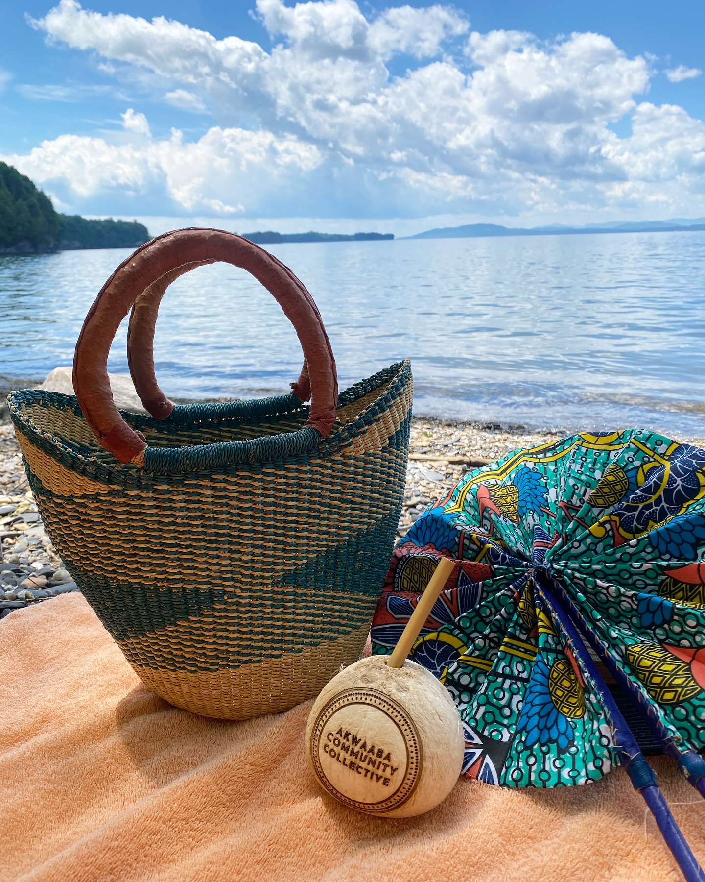 Beat the heat with a fresh coconut & a fabric fan by the lake ☀️