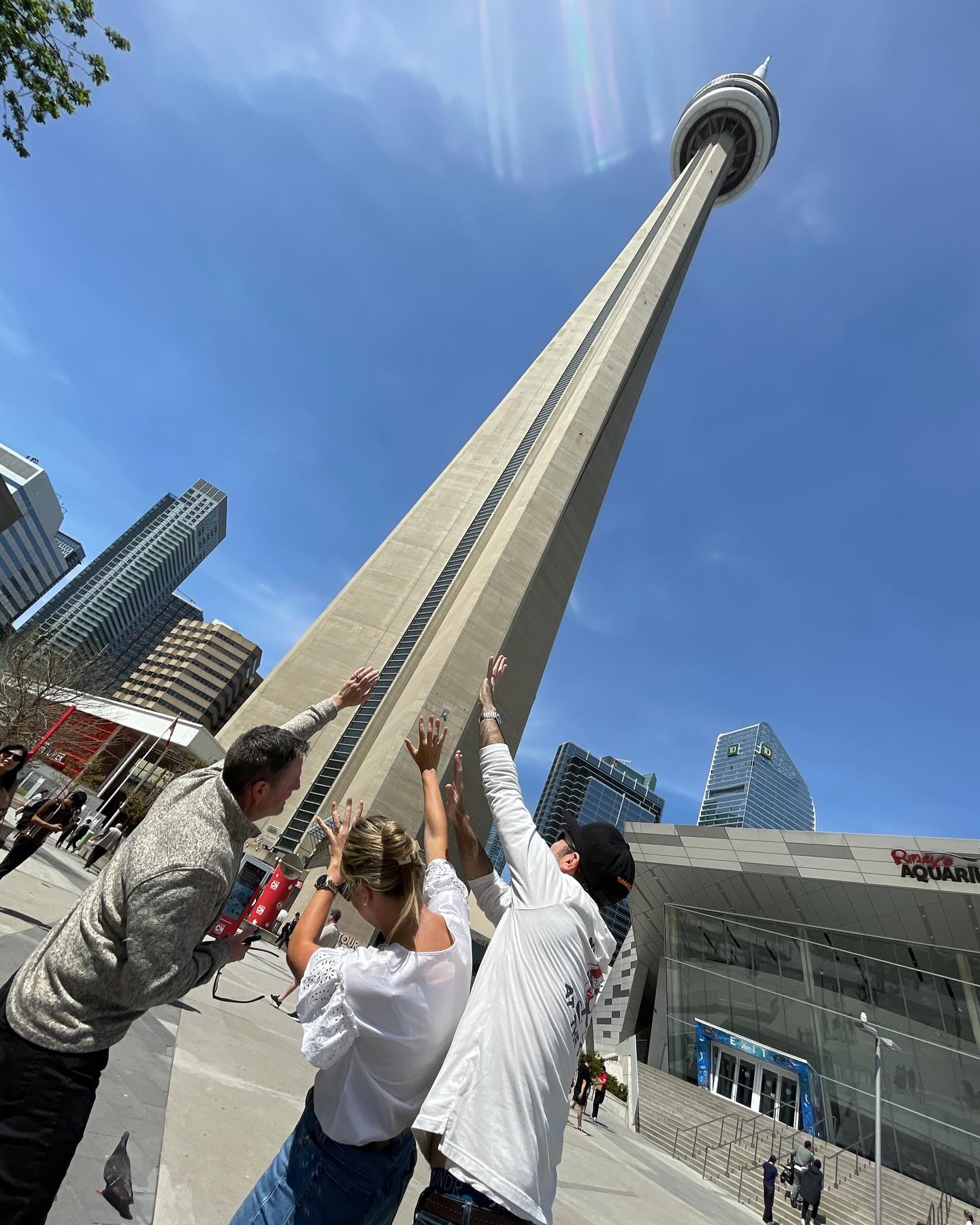 Why are these teams trying to hold on to the CN Tower? Find out about this and more! Outdoor team building in #downtowntoronto🇨🇦 #teambuildingtoronto