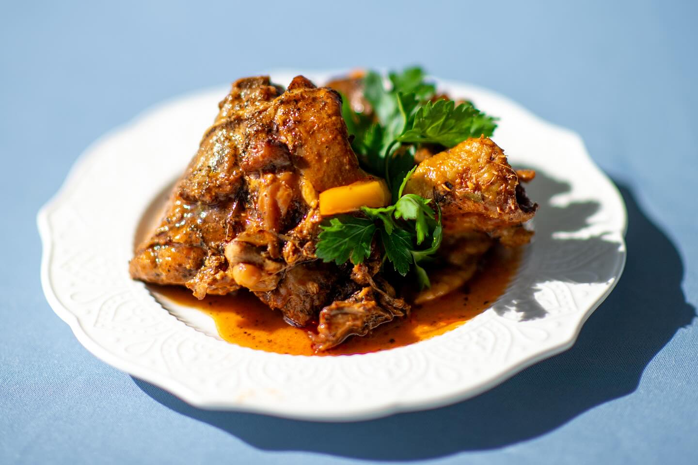 There’s just something about our chicken that makes mouths happy. #haitianfood #chickencreole photo by @artvestastudio