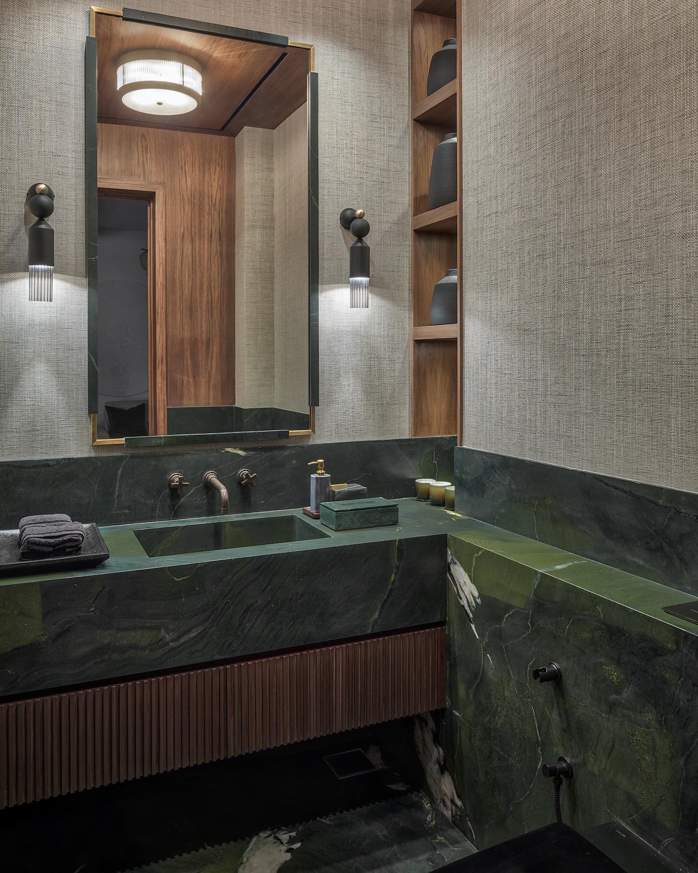 A powder bathroom that feels equal parts elegant and glamorous...
With its gorgeous avocado green that sets the tone for a moody experience, this space creates that stop-and-stare moment in the residence..
The mix of metals with a beautiful rustic bronze wall mounted faucet, matte black fixtures and brass touches in the lighting, the experience is layered and textured..
Our custom marble mirror is stunningly crafted to create expanse alongside the warm toned niches and ceiling that complete this room...
.
.
Interior Architecture & Design: @casa_novo
Interior Styling: @casa_novo
.
.
.
.
Photography : @pulkitsehgal7
#design #interior #homedecor #architecture #home #decor #interiors #homedesign #art #interiordesigner #furniture #decoration #interiordecor #interiorstyling #luxury #designer #handmade #inspiration #livingroom #furnituredesign #realestate #instagood #style #architecture #designinspiration #interiordecorating #bathroom #bathroomdesign #bathroomdecor #marbl