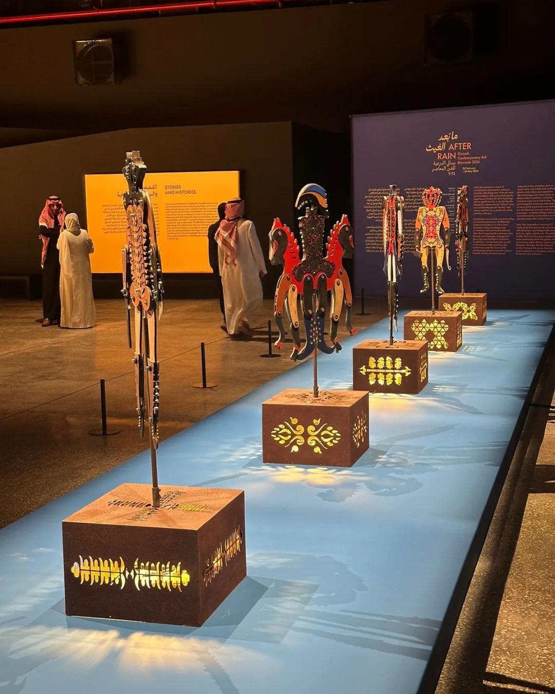 Congratulations to our long-term DAS collaborator Dhali Al Mamoon on showcasing his work 'Kather Nripati' (Wooden Lord) at the second edition of Diriyah Contemporary Art Biennale titled After Rain.The logistics of Dhali Al Mamon’s presentation is supported by the Samdani Art Foundation.
Dhali Al Mamoon is an artist whose work engages with the persistence of colonialism as a historical trauma. Al Mamoon's series of kinetic sculptures comprising Kather Nripati (Wooden Lord) derive from traditional palm-leaf puppets that made fun of the flailing movements of the sepoys, the Indian soldiers hired by the British East India Company. Originating around the time of the Sepoy Mutiny (1857-59), the dolls were a subtle form of resistance that temporarily subverted the usual hierarchical order. Life-sized, wooden versions of the toy mounted on plinths rotate periodically. Their arms and legs clatter and flare in all directions, giving them a comical but menacing presence.
Also, congratulations to Artistic Director of the Diriyah Biennale, Ute Meta Bauer, and her team, who have been long-term visitors of DAS. The biennale is organized by the Diriyah Biennale Foundation and takes place in the JAX District. Featuring work by artists from Saudi Arabia and around the world, the exhibition explores the role of a contemporary art biennial in a country that is undergoing rapid social change.
Photograph 1 - Installation view of 'Kather Nripati' (Wooden Lord) at the Diriyah Contemporary Art Biennale.
Photograph 2 - Our Co-founder Rajeeb Samdani with Dhali Al Mamoon.
@dhakaartsummit
@srihatta_sylhet
@nadiasamdani
@rajeebsamdani
@dhakadiana
@rux_q
@biennale_sa
@utemeta
@dhalimamoon
@swilin_haque
@sazzad1985
@iftekharnoor
#dhakaartsummit #samdaniartfoundation #dhaka #art #artwork #DAS #exhibitions #contemporaryart #dhalialmamoon #Diriyah #biennale