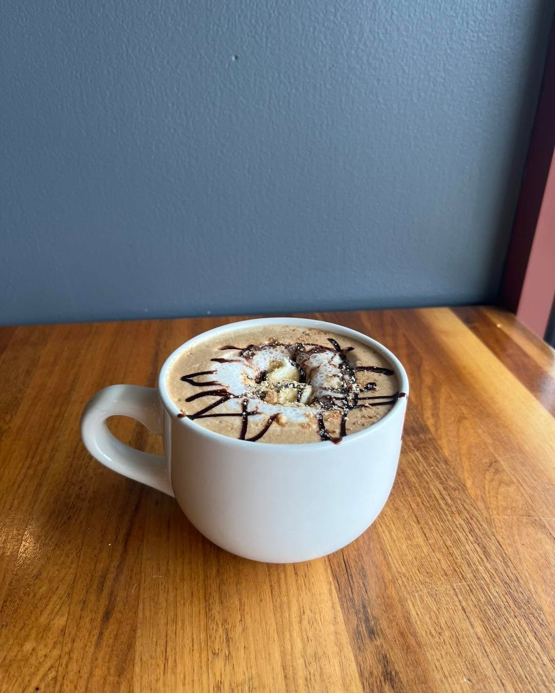 🔥🍫 It’s National S’mores Day! 🍫🔥
No campfire? No problem! Stop into Novios to celebrate and try one of these babies! (It’s the s’mores latte, and it’s excellent hot or iced!)
Pro tip: they run on the sweet side, so if you get nervous ordering fun drinks, just ask your barista to make it with half the sweetness.