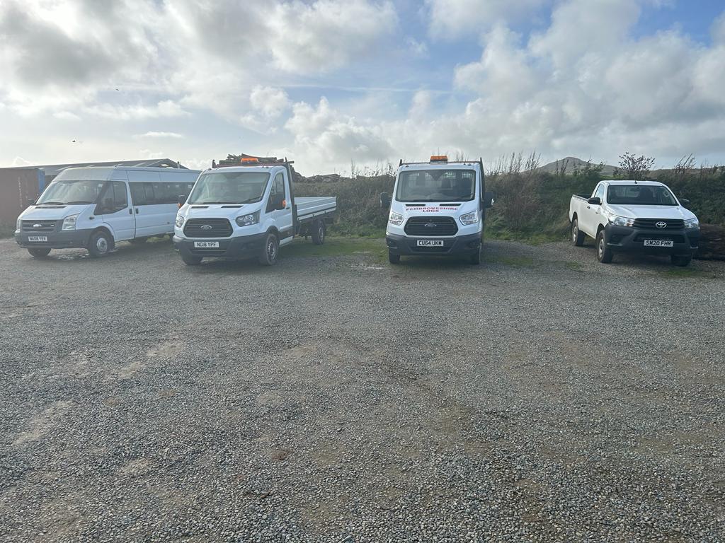 The Pembrokeshire Logs fleet. You'll see these vehicles delivering across the county. Ask the guys on board how you can make an order, or scan the QR code in the window, to guide you straight to our website.