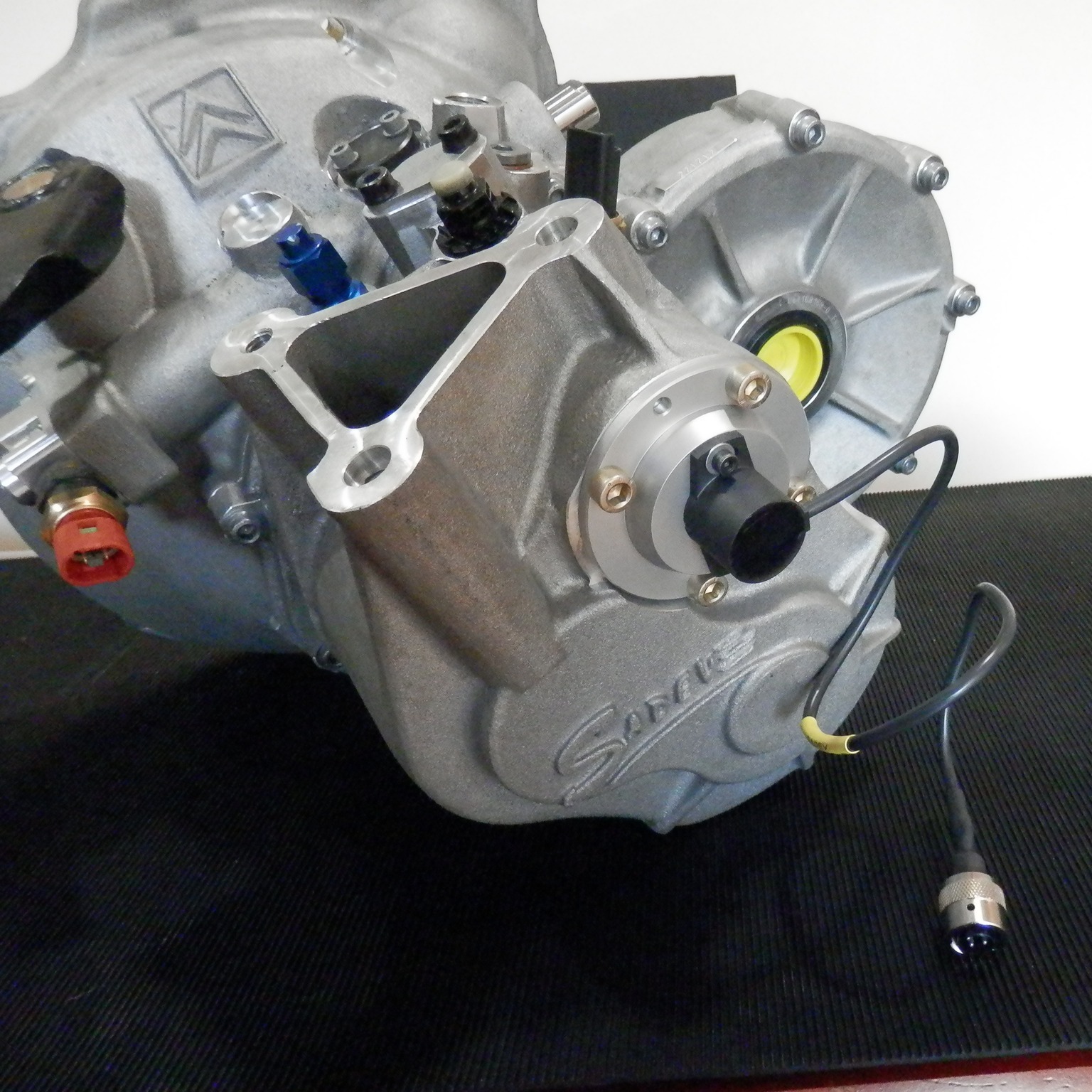 SADEV CITROEN C2R2 GEAR POSITION SENSOR ADAPTION - SWR has recently developed an elegant solution to run a hall effect gear position sensor with the Sadev C2R2 Max gearbox! Replacing the old 5-pin contact sensor with a 4-pin hall effect contactless sensor, the increased accuracy allows use with paddle shift systems and closed loop full-throttle ignition cut systems. All new adaption parts are designed and machined in house on our CNC 4-axis milling machines and CNC lathe.
#SWRMotorsport #SADEV #Gearbox #Transmission #competition #racing #motorsports #sequential #engineering #motorsport #machining #design #bespokedesign #designandengineering #cncmachining #bespoke #aluminium #PaddleShift #CNC #c2r2max #citroen