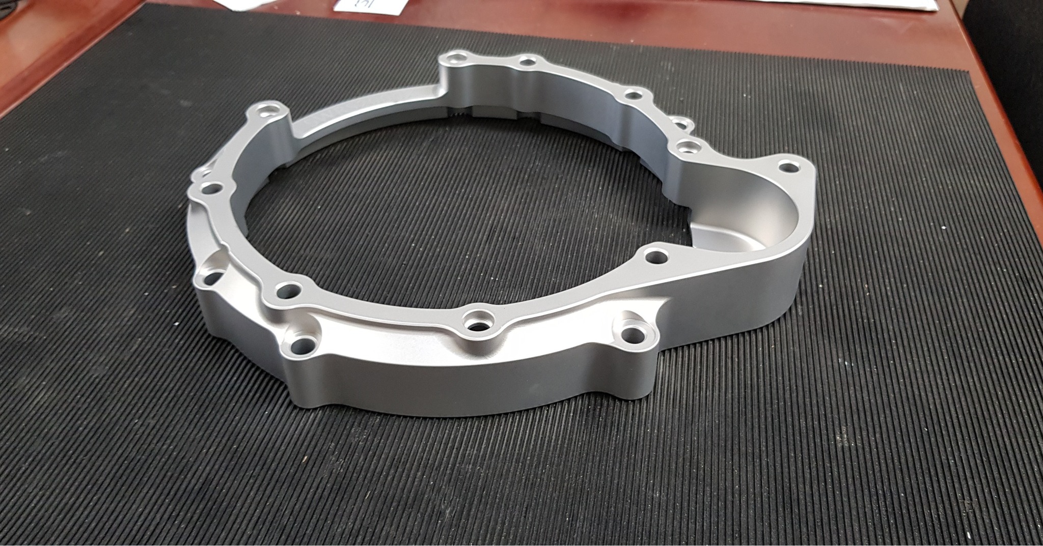 Reverse-engineered from a damaged original, this mounting plate for a Proton engine to an Xtrac gearbox undertook some development at SWR; laser scanned into 3D CAD and then redeveloped for increased strength, it was finally machined and vapour-blasted in house. The assembly was kept identical and the profile of the plate remained the same - we just made it a little stronger! 😁👌
#SWRMotorsport #design #designandengineering #machining #bespoke #bespokedesign #engineering #cncmachining #aluminium #CNC #Aquablast #Gearbox #Transmission #xtrac