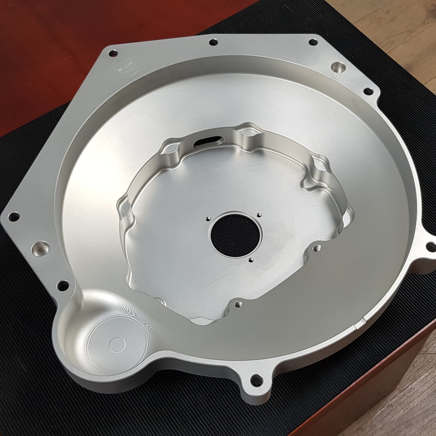 A fresh bespoke design of adaptor plate for the LS3 Chevrolet engine to the Hewland IGTC-200 in-line RWD gearbox. It was also designed with a mount and a port through the plate for a concentric hydraulic clutch release slave cylinder and piping. As with all our aluminium engine to gearbox adaptor plates, this was machined in-house on SWR's 4-axis CNC machines and cleaned and finished using our in-house vapour blaster.😁👌
#SWRMotorsport #motorsport #motorsports #Gearbox #Transmission #CNC #aluminium #bespoke #cncmachining #engineering #designandengineering #bespokedesign #Aquablast #design #machining #hewland #hewlandgearbox #chevroletls3
