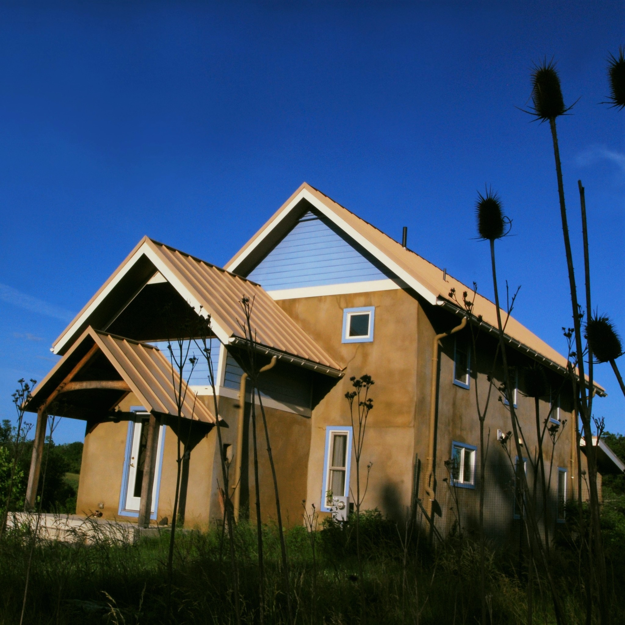 This home is the only speculative house I've designed. Built at EcoVillage in Loudoun County VA, I worked with the builders to design a modest, #passivesolar #ecofriendly home. It features #strawbale insulation, #limeplasters, integrated #photovoltaics, #compostingtoilets & a #graywater system, radiant floor heating, and a sweet little sleeping porch