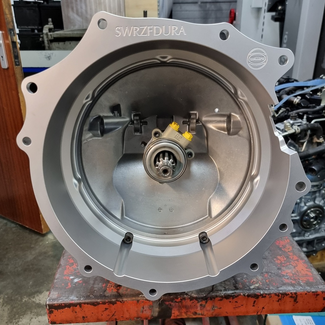 Between the Duratec engine and the ZF gearbox, this adaption plate was designed to be as slim as possible for tight-fitting assemblies. At 125mm from the engine to gearbox mounting faces, the fitment is as tight as can be allowed by the gearbox's clutch shaft.
We design and machine parts in-house and are always happy to discuss projects that require reverse engineering or are completely bespoke pieces. Our 3D laser scanner, 3D CAD and 4-axis CNC mills allow us to develop new parts to replace or replicate existing parts - including the fitment and redesign of any gearbox to engine assembly!
#SWRMotorsport #Transmission #CNC #competition #Gearbox #aluminium #motorsports #bespoke #cncmachining #engineering #designandengineering #bespokedesign #Aquablast #motorsport #design #machining #duratec #ZF #zfgearbox #fordduratec