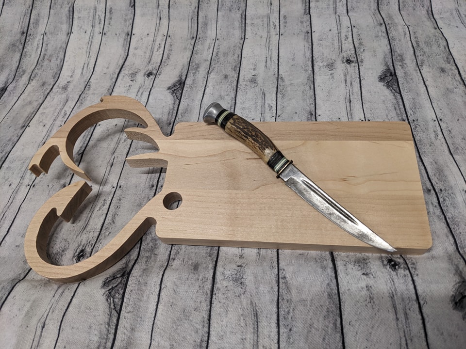 A customer requested a unique cutting board for a retiring hunting and fishing guide. Love how the idea turned out.