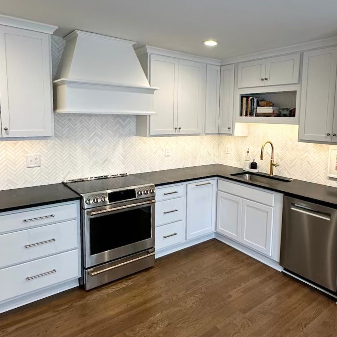 This newly remodeled kitchen in Mission, Kansas is a stunning blend of modern elegance and timeless sophistication. The white cabinets create a bright, airy atmosphere, while the natural stone herringbone backsplash adds texture and visual interest, giving the space a subtle but luxurious feel. The Nero Orion Honed Granite countertops serve as a bold contrast, with its deep, rich tones and intricate veining adding depth and drama to the overall design.
To compete this client's remodel, we did semi custom pre-finished cabinets, brushed gold finishes, a Moen sink faucet, under cabinet lighting, and also updated their electrical devices.
Countertops @canaanstoneworks
#Reliance #kitchendesign #kitchenremodel