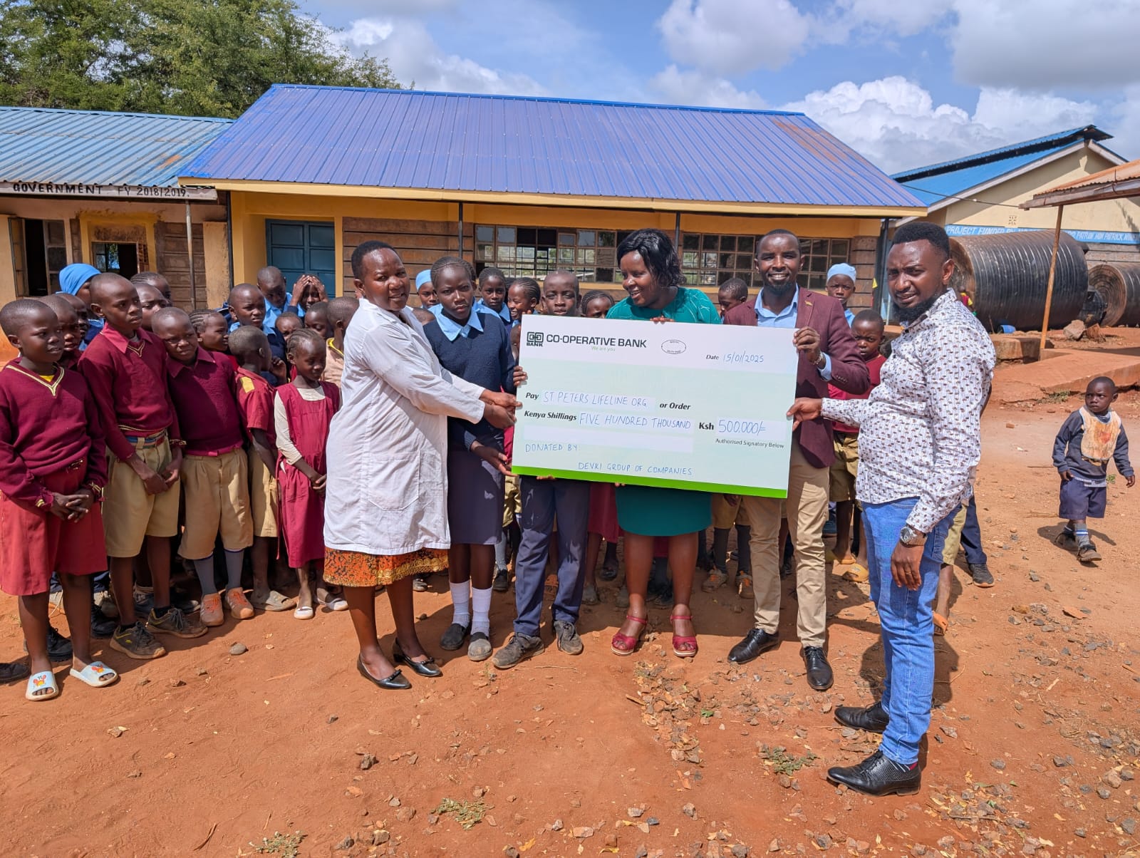 We are hugely grateful to Narendra and Neeta Raval of the Devki Group of Companies in Kenya, for their very generous donation of 500,000/- (c£3,300) to our primary schools lunchtime feeding programme. Cheque being presented to us at Kithinge primary school, one of the 9 beneficiary schools. Asanteni sana!
Hope through Education.