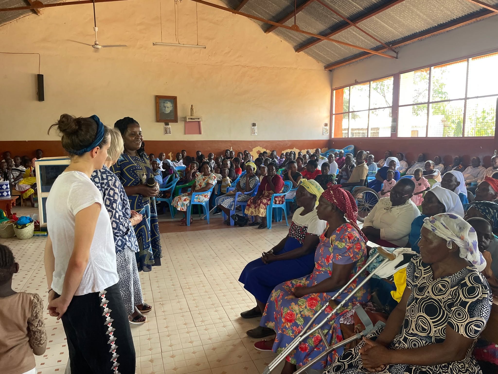 Our visit to St Peter's - our visitors introducing themselves at Sunday Mass; a trek thru the bundu to visit families with disabled children; with this lovely child Tysy, who has brittle bone disease, but with special care in place shenattends St Peter's school every day; Daisy with Natasha, on of our longstanding and most loveable of children.