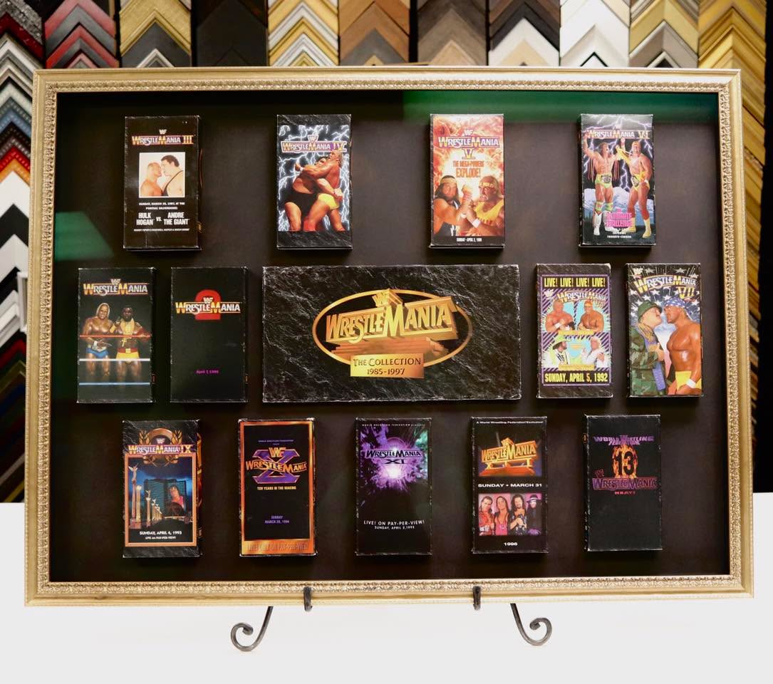 CAN YOU SMELL WHAT THE FRAMERS ARE COOKIN’? 🍳
The ornate gold moulding that this Wrestlemania VHS Collection is housed in originally wasn’t deep enough, but with a custom extension on the back, we can make just about any moulding accommodate any object, no piledriving necessary! The “tapes” are also not tapes at all— it’s black foamcore made to look like tapes, keeping the frame in a lighter weight class!
Unsure if an item you have is framable? We remain undefeated in the ring, yet to meet an object we couldn’t frame, and we love new challengers! Bring us anything and everything and we’ll make it work, from signed autographs to steel chairs!
#frameitonbloor #customframing #framing #artframing #shadowbox #toronto #downtowntoronto #bloorbythepark #bloorwestvillage #shoplocal #smallbusiness #torontosmallbusiness #wwe #wrestlemania #memorabilia #wrestlingmemorabilia #hulkhogan #randysavage