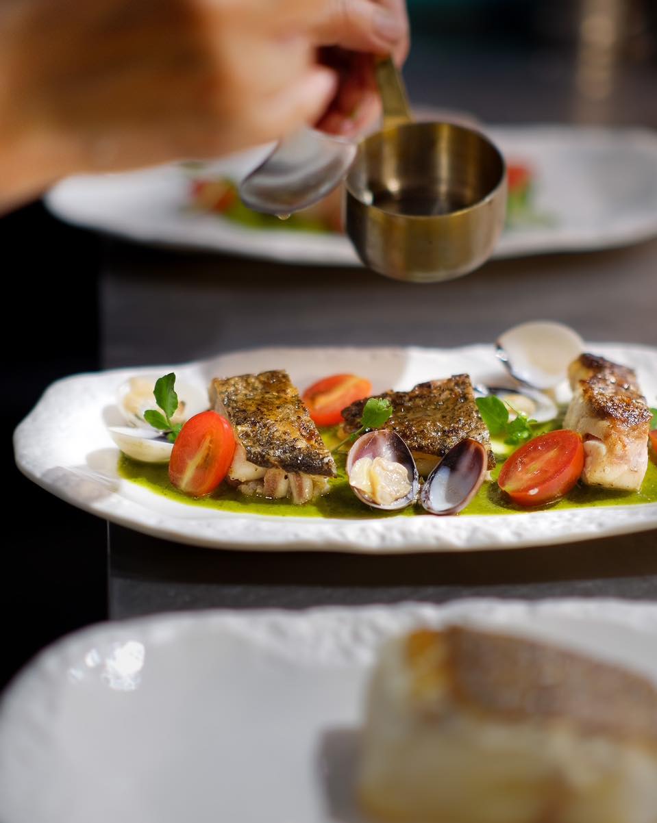 Grilled grouper, kissed by the flame, served with a bright herb sauce and tomato salad #SaigoneseEatery #GrilledGrouper #FromOurKitchen # #phuquoc #foodie #phuquocisland #phuquoctrip #restaurant #phuquoctravel #phuquoctravelguide
